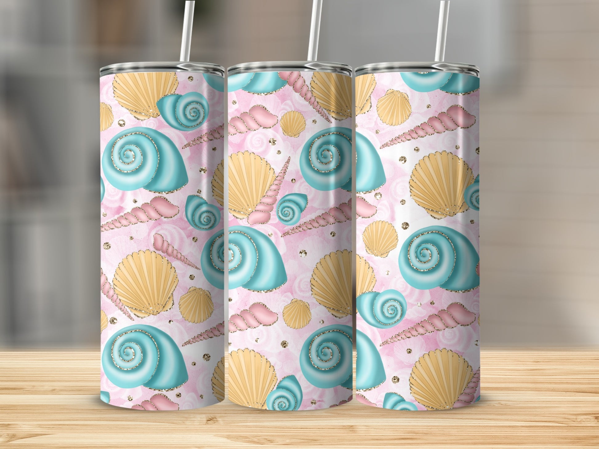 Three tumblers with a pink seashell and pearl pattern.