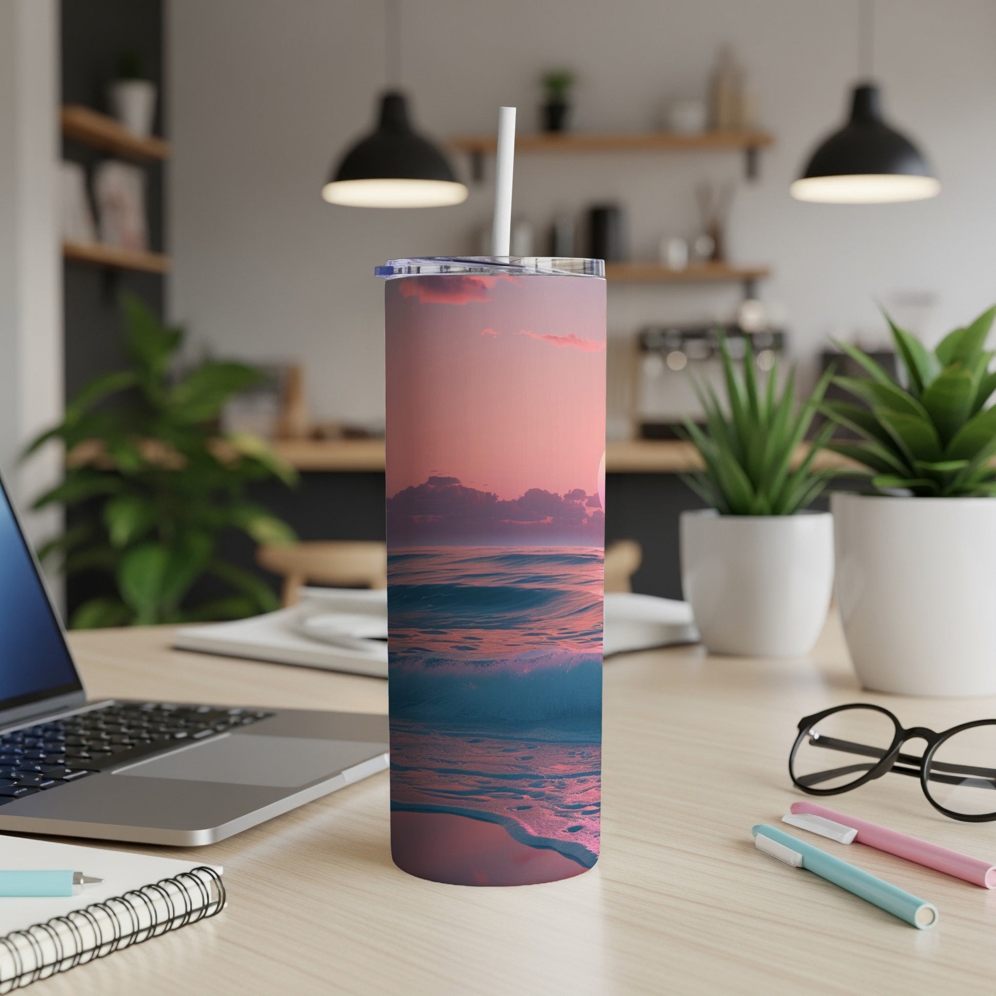 Pink and blue ocean waves at sunset on a white travel tumbler.