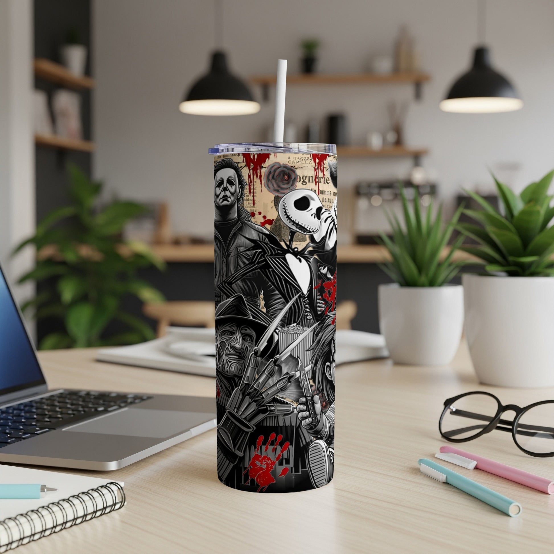 Tall tumbler featuring various horror movie characters and motifs.