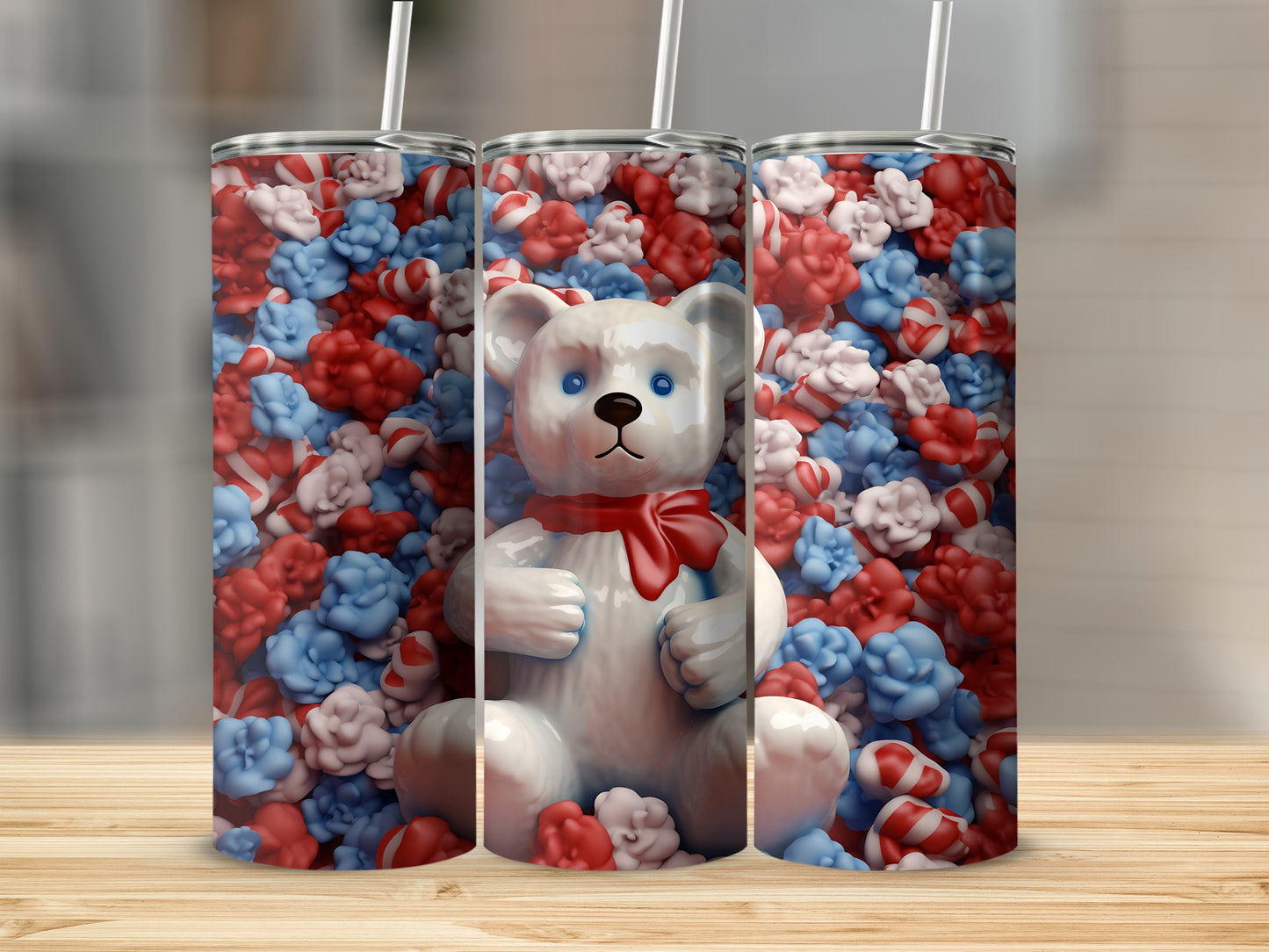 White teddy bear with red bow against a background of red, white, and blue candies.