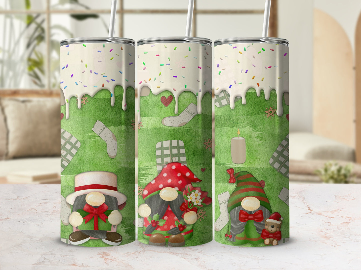 Three gnomes with festive designs on white tumblers with straws.