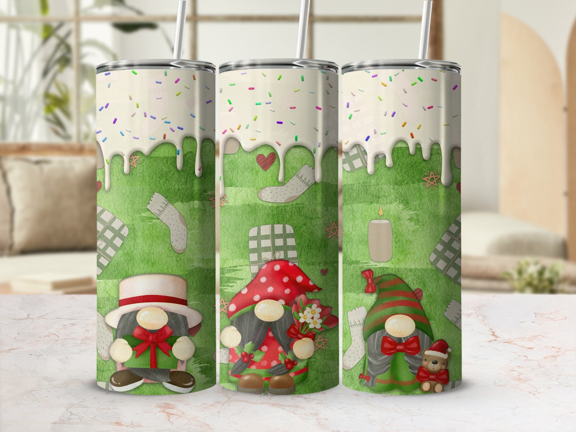 Three gnomes with festive designs on white tumblers with straws.