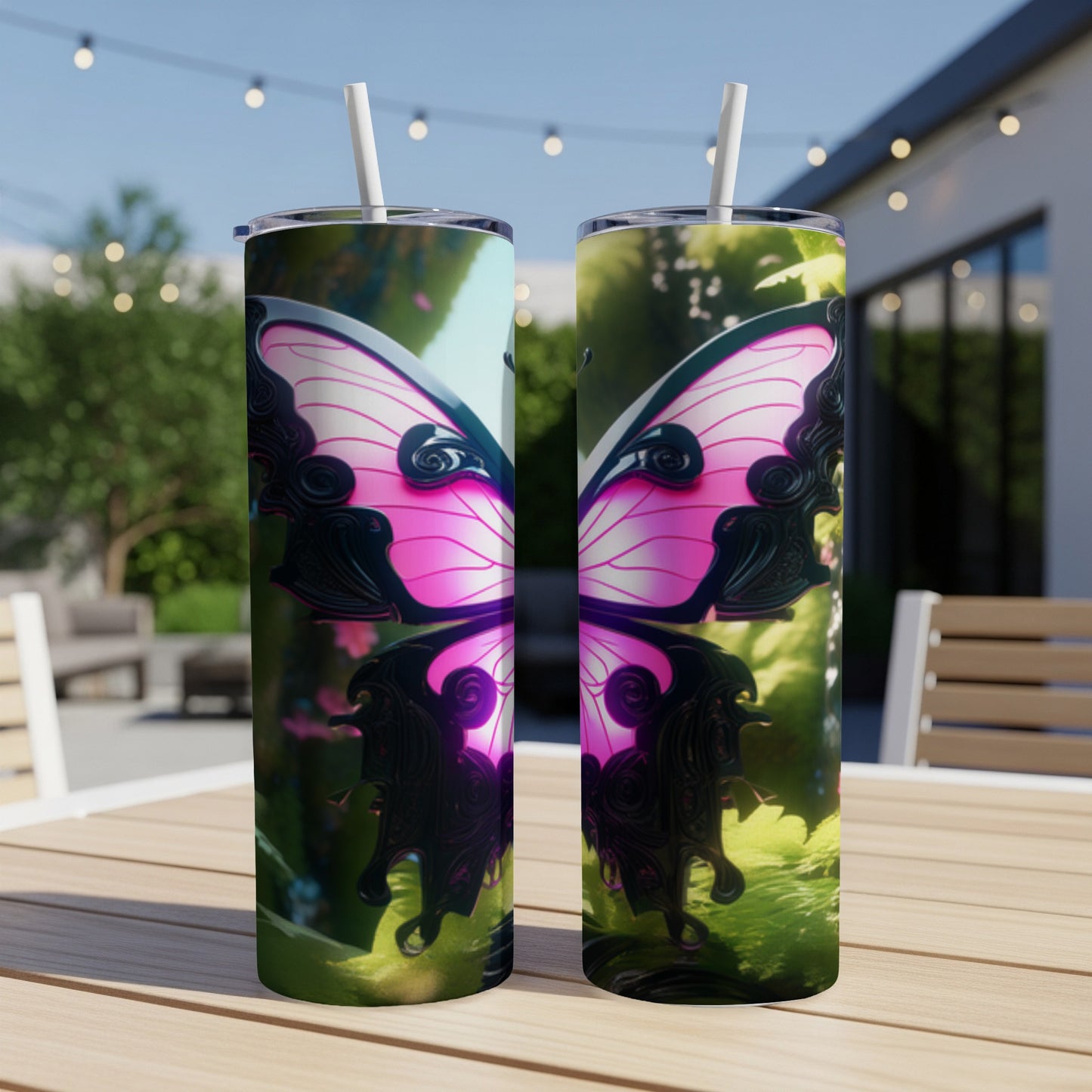 Two tumblers with a pink butterfly wing design on an outdoor table.