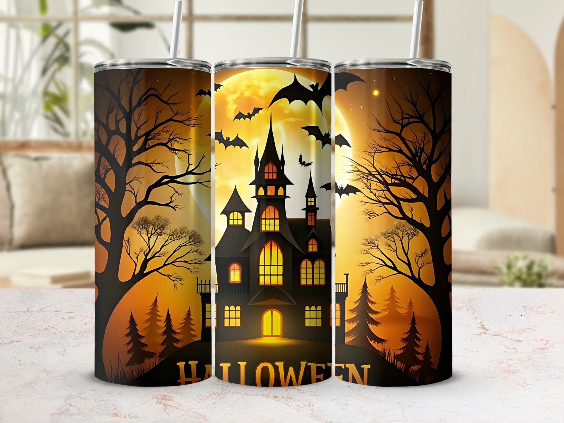 Three tumblers featuring a haunted house, bats, and Halloween text.