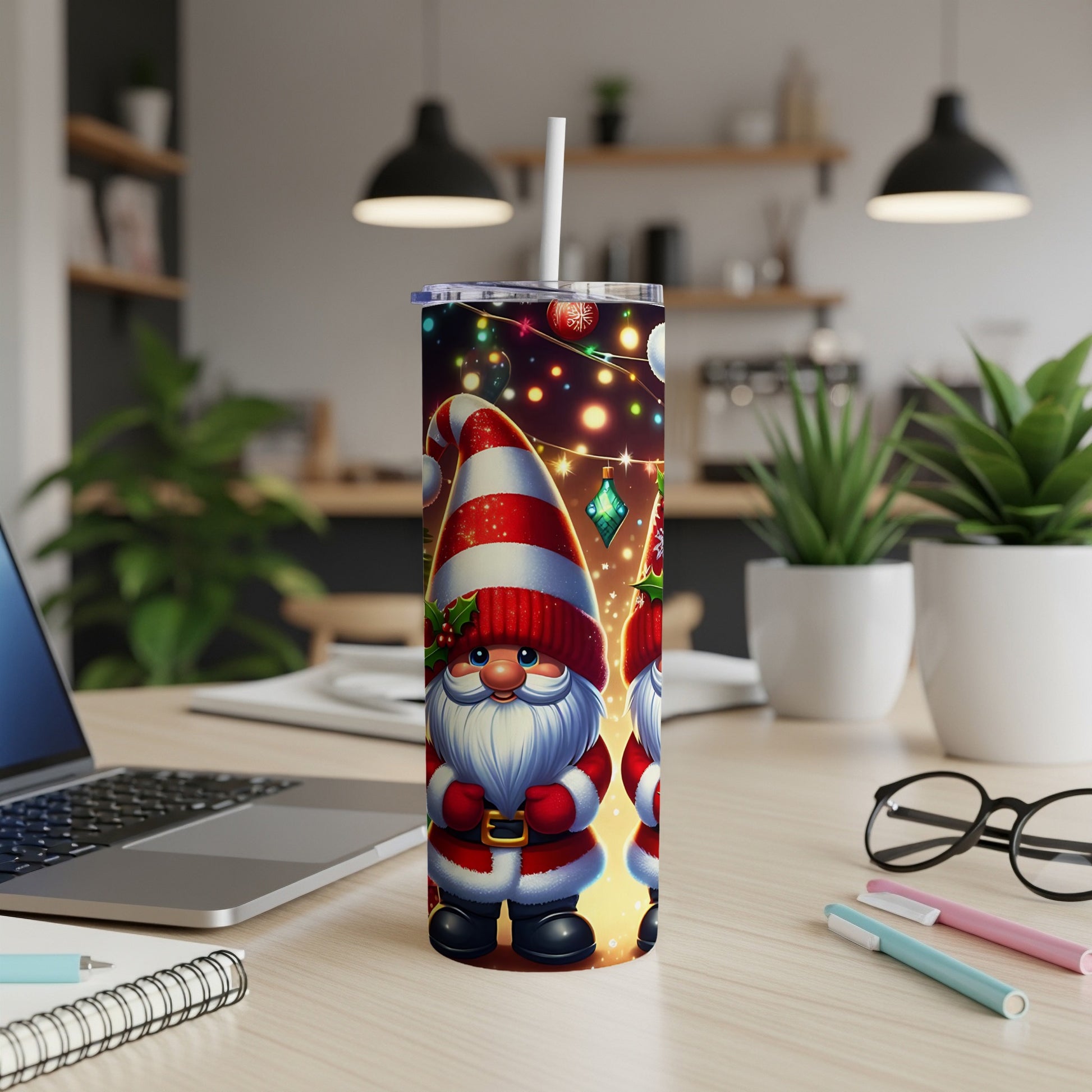 Two gnomes wearing striped hats and Santa suits stand on a desk.