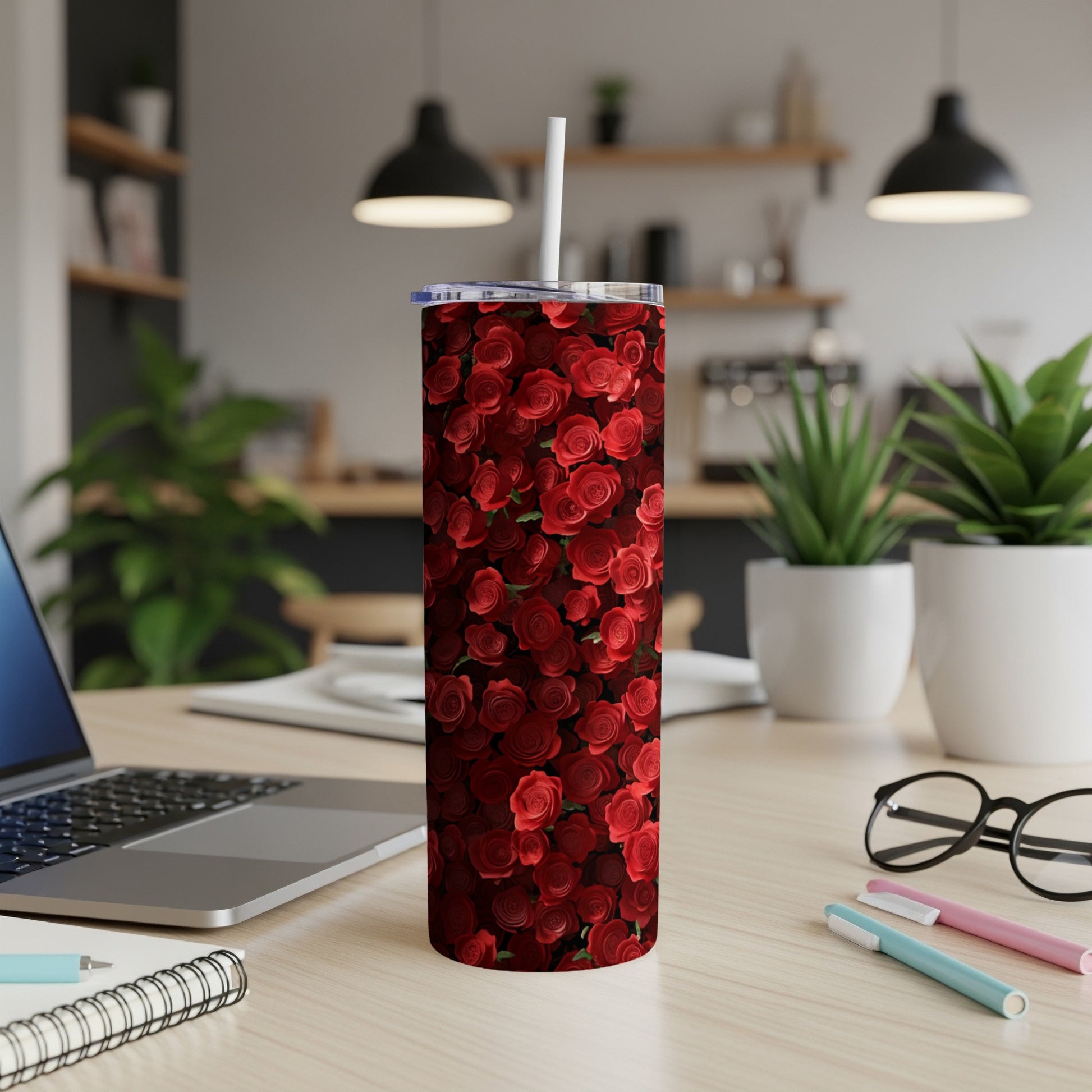 Red roses pattern on a white stainless steel tumbler with a straw.