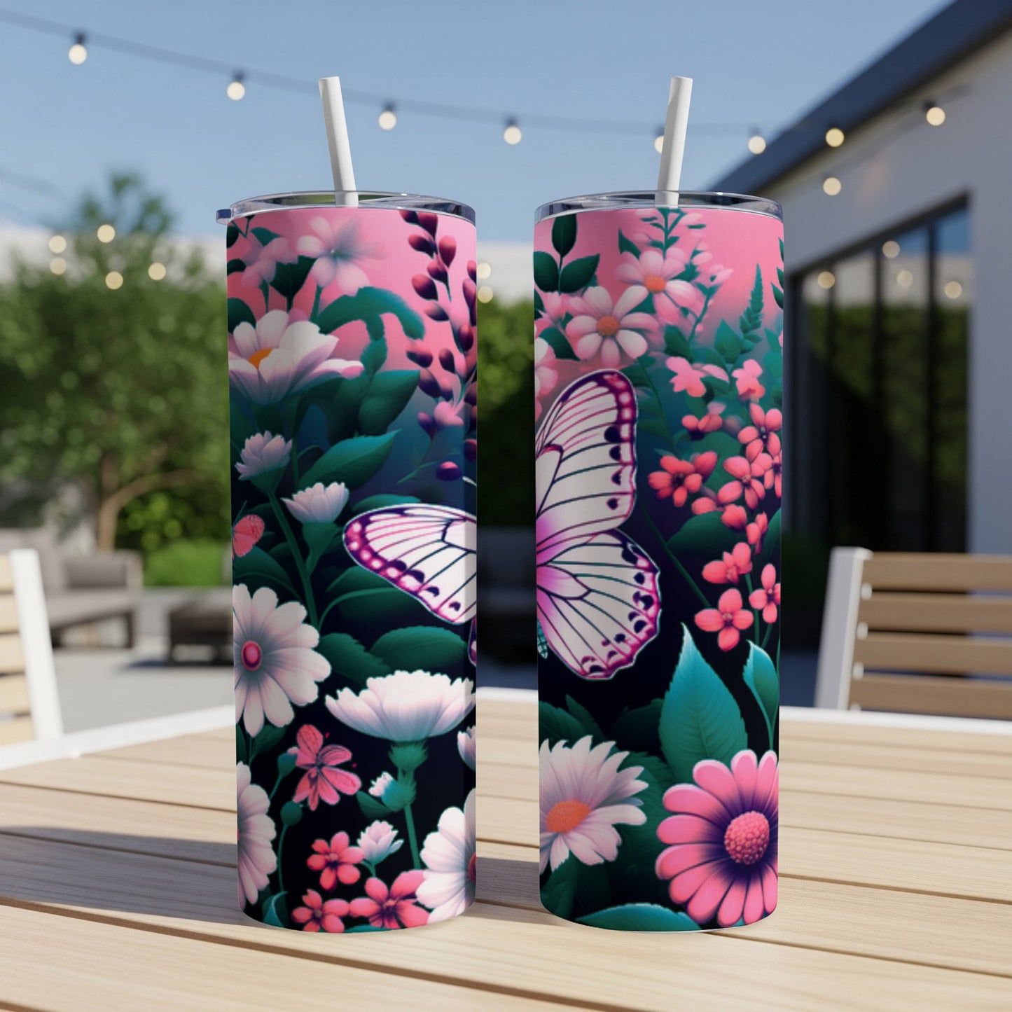 Two tumblers with pink and white flowers and a butterfly design.