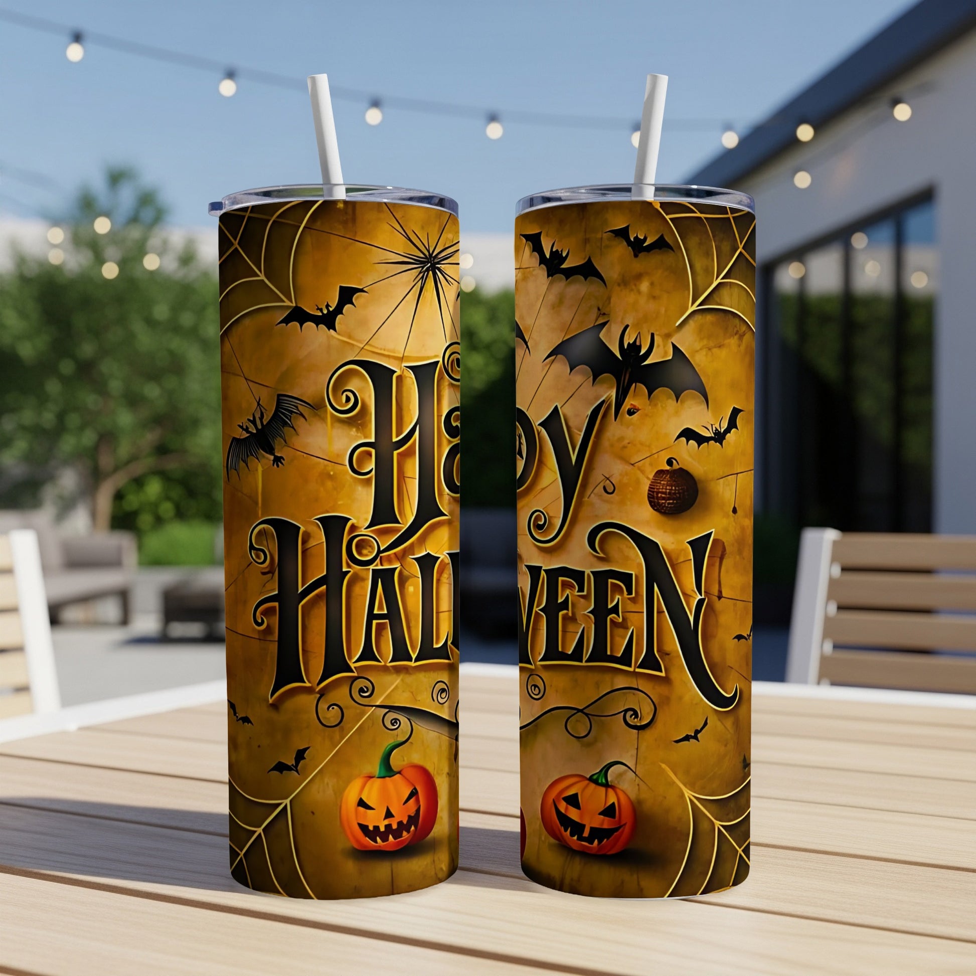 Two tall Halloween themed tumblers with bats, pumpkins, and cobwebs.