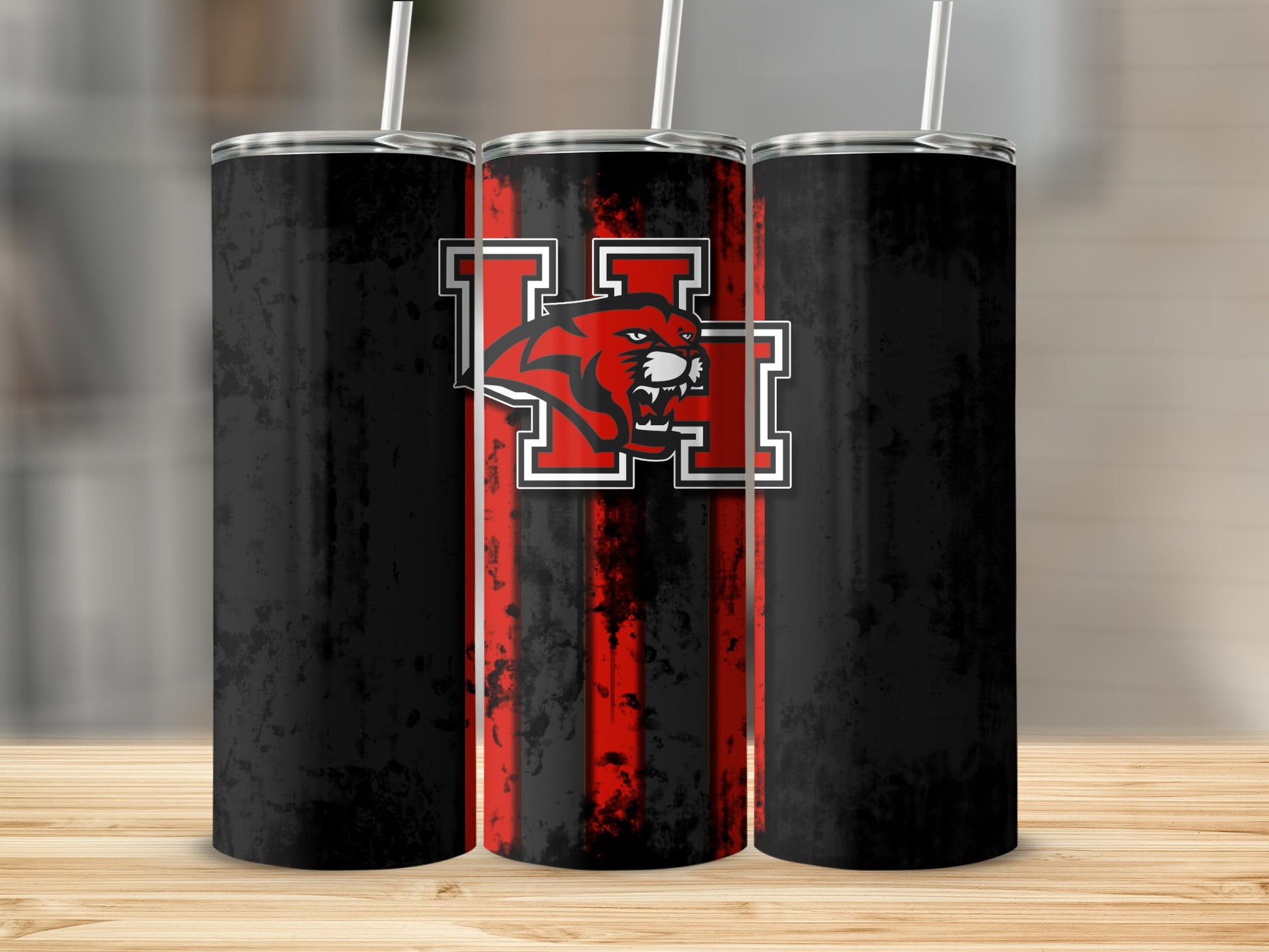 Three tumblers with black and red distressed stripes featuring a panther logo.