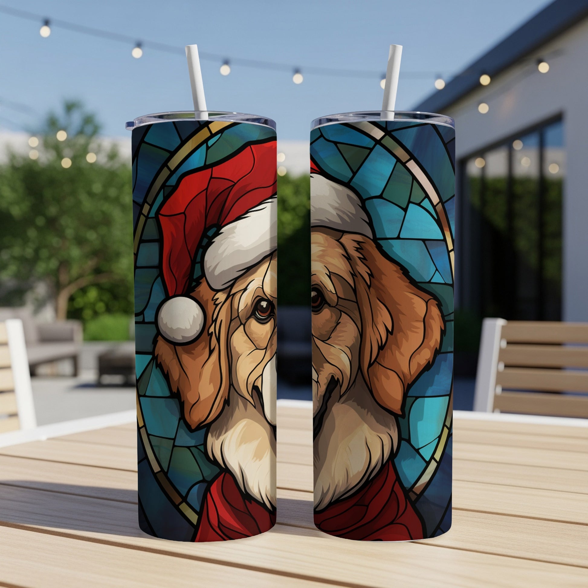 Golden retriever wearing Santa hat and scarf on stained glass tumbler.
