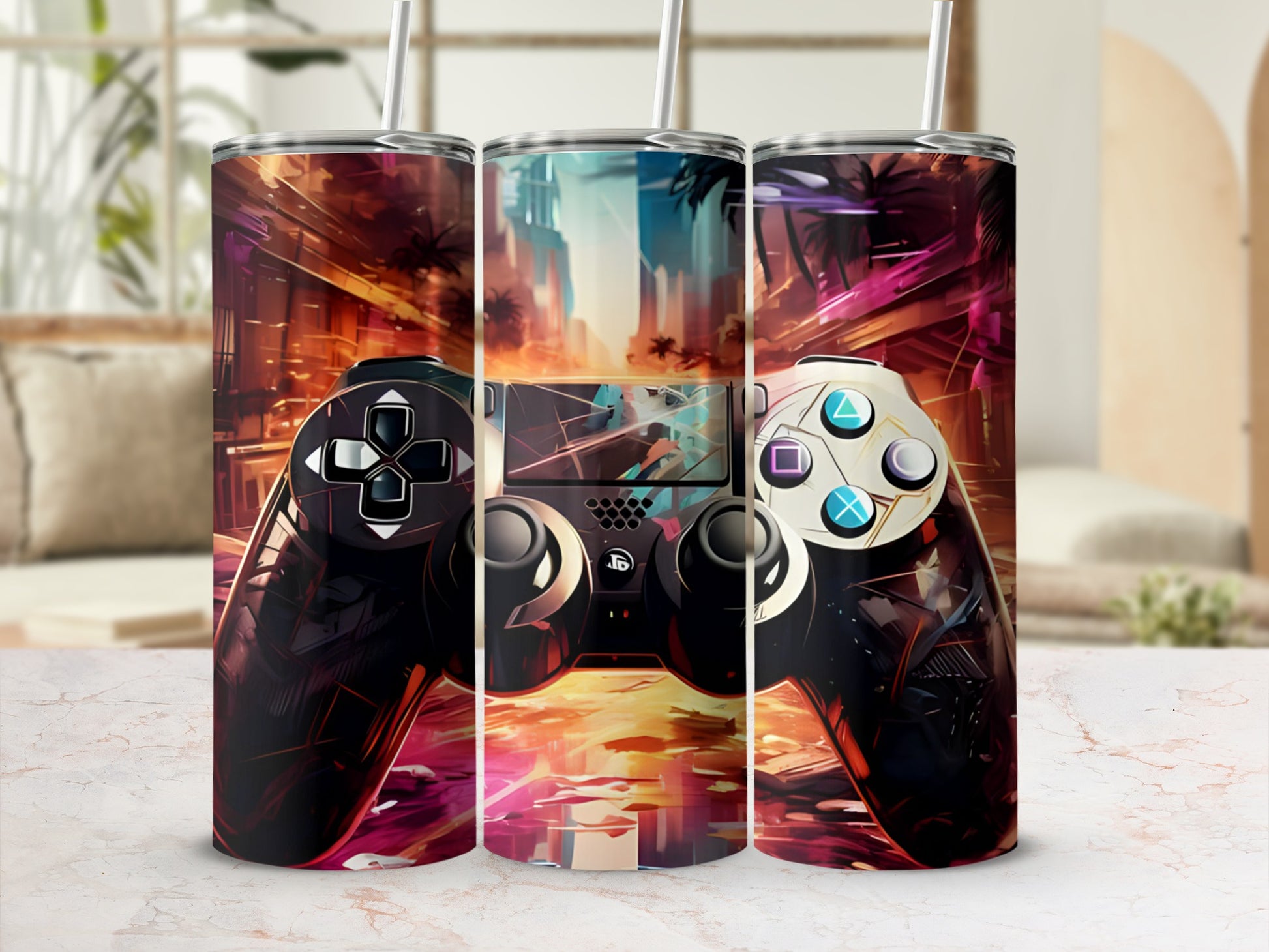 Gamer controller design on three tall, slim tumblers with straw holes.