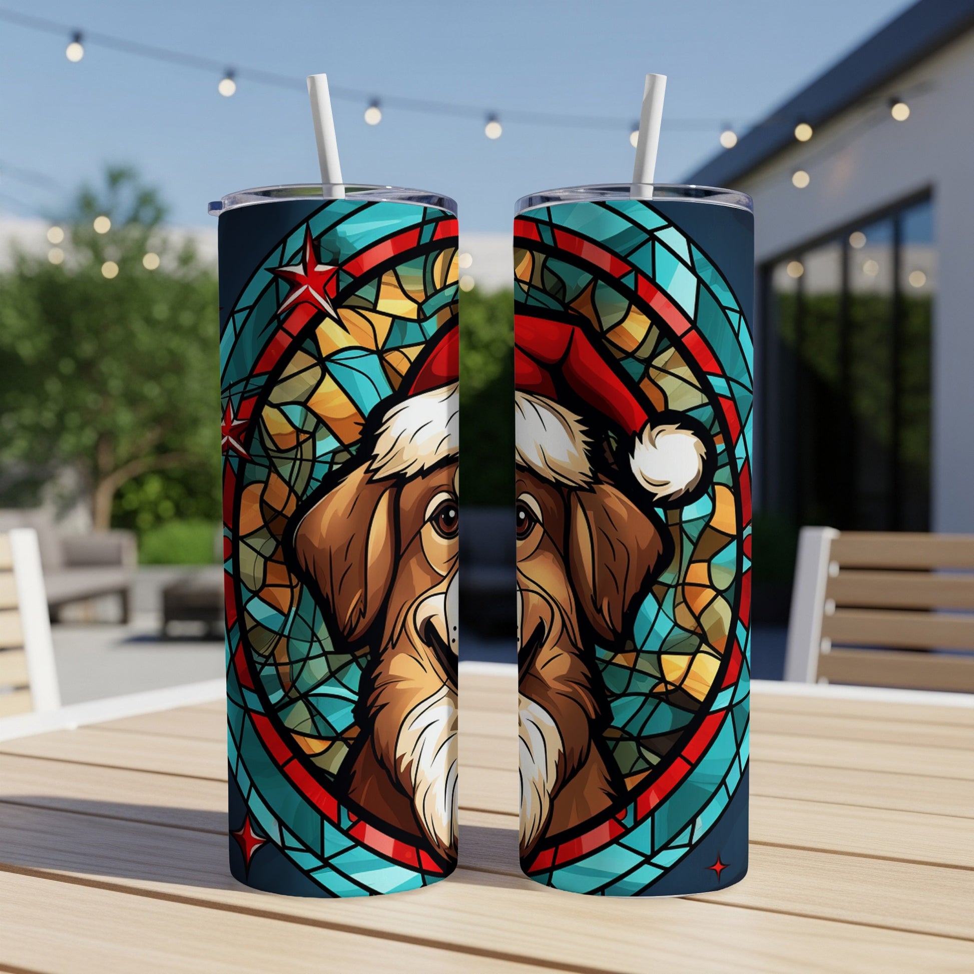 Two tumblers featuring a dog wearing a Santa hat in a stained-glass design.