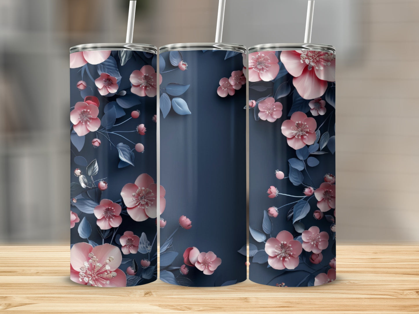 Three tumblers with a navy blue background and pink floral pattern.