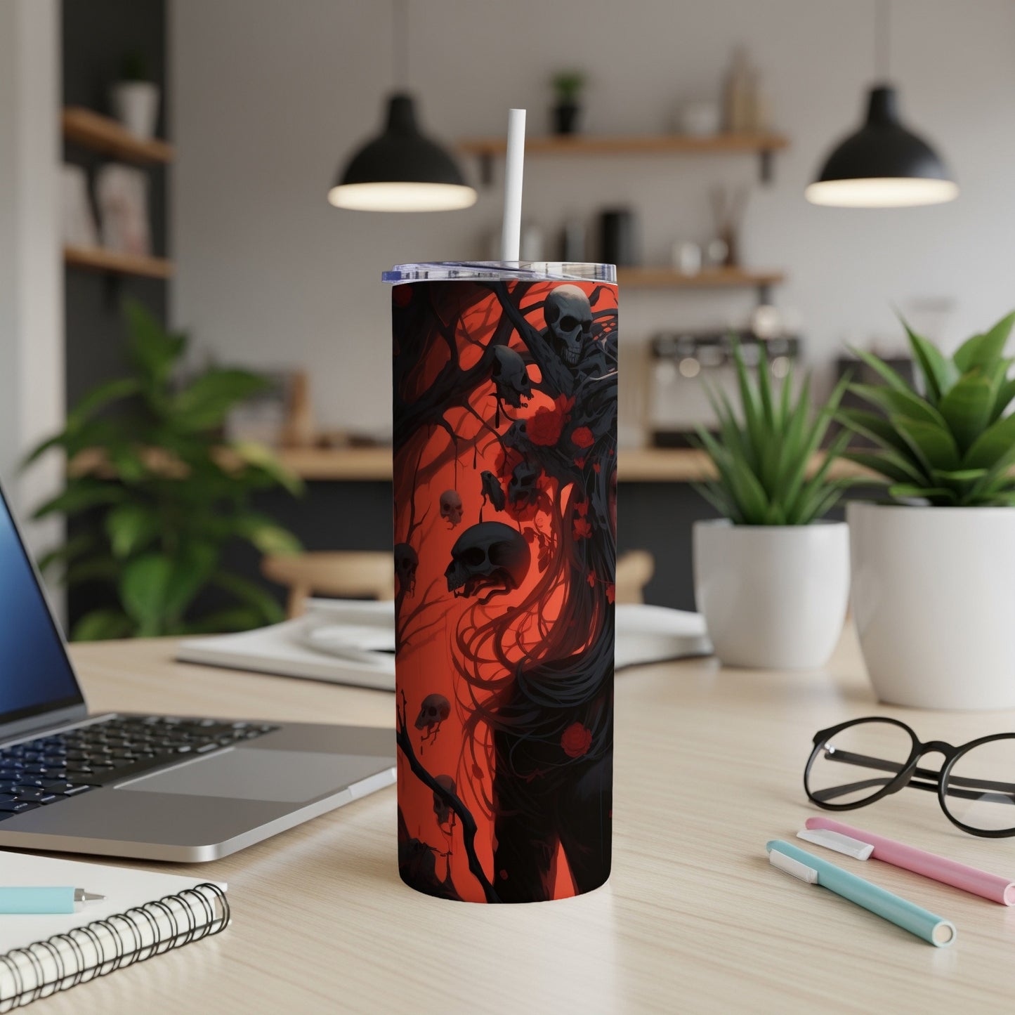 Tumbler with a dark, gothic design featuring skulls and roses on a red background.