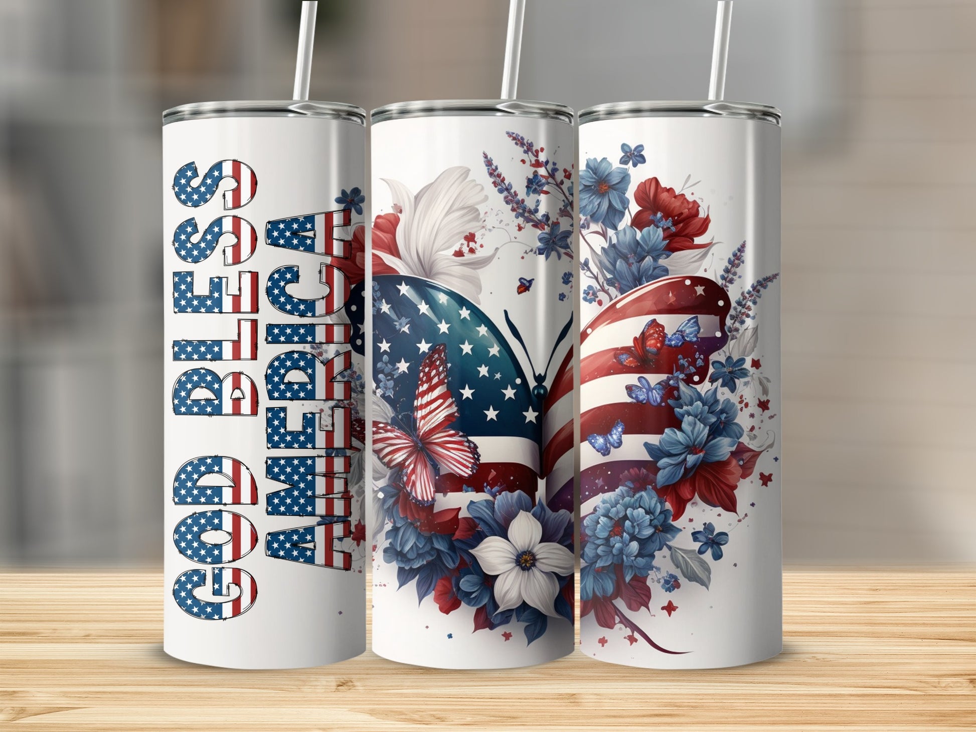 Three God Bless America tumblers with patriotic floral designs.
