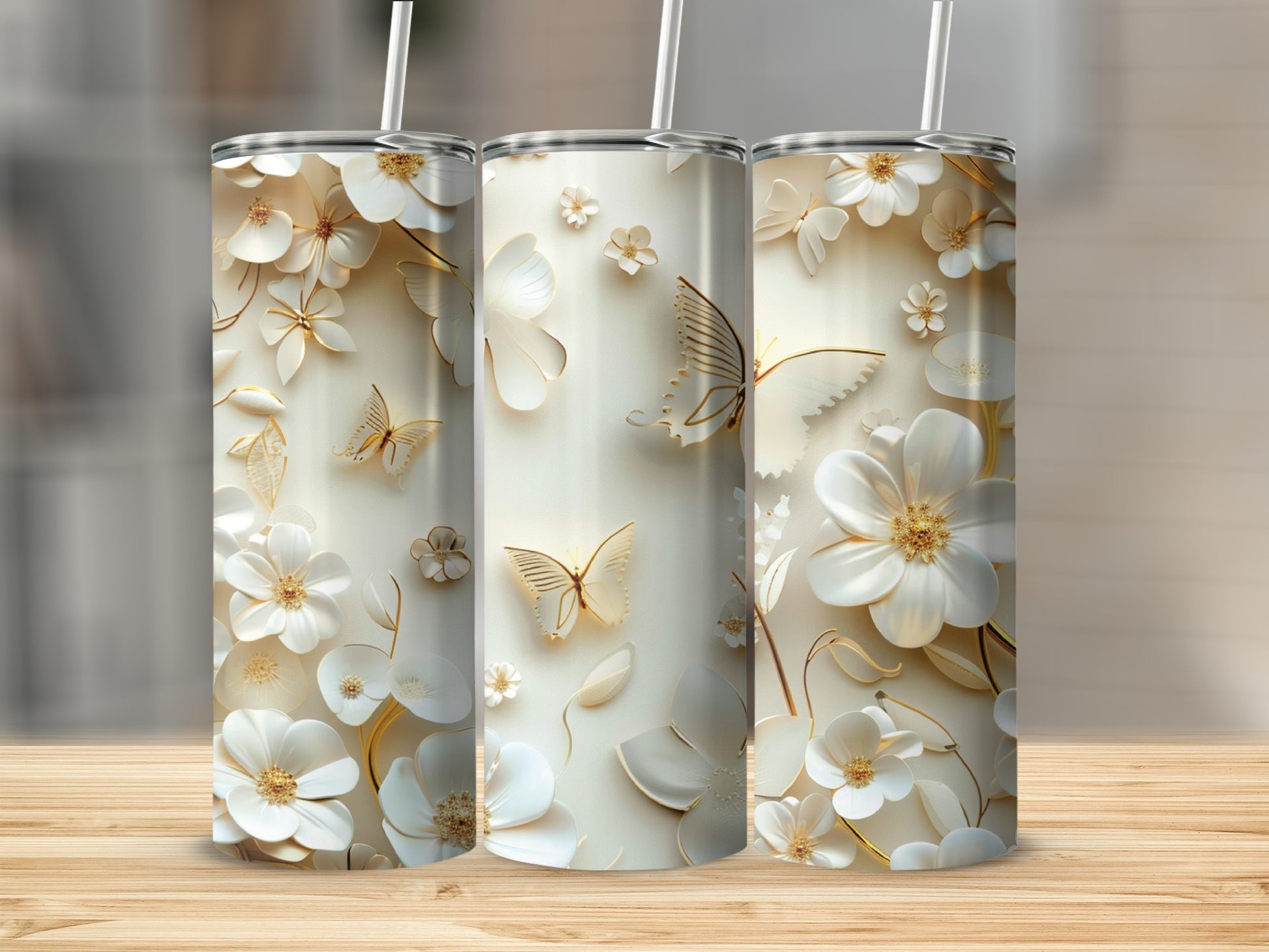 Three white tumblers with embossed floral and butterfly designs.
