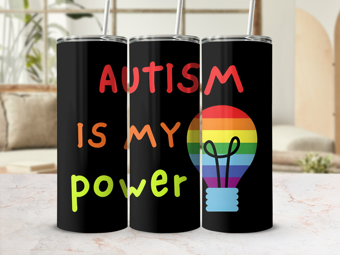 Black tumbler with "Autism is my power" and rainbow lightbulb graphic.