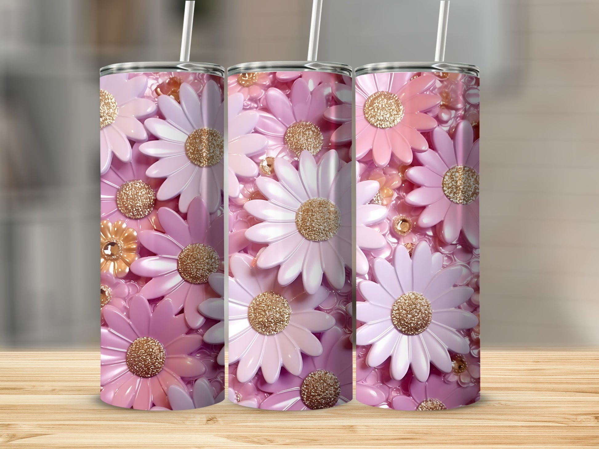 Three pink and white daisy tumblers with glittery centers on a wooden surface.