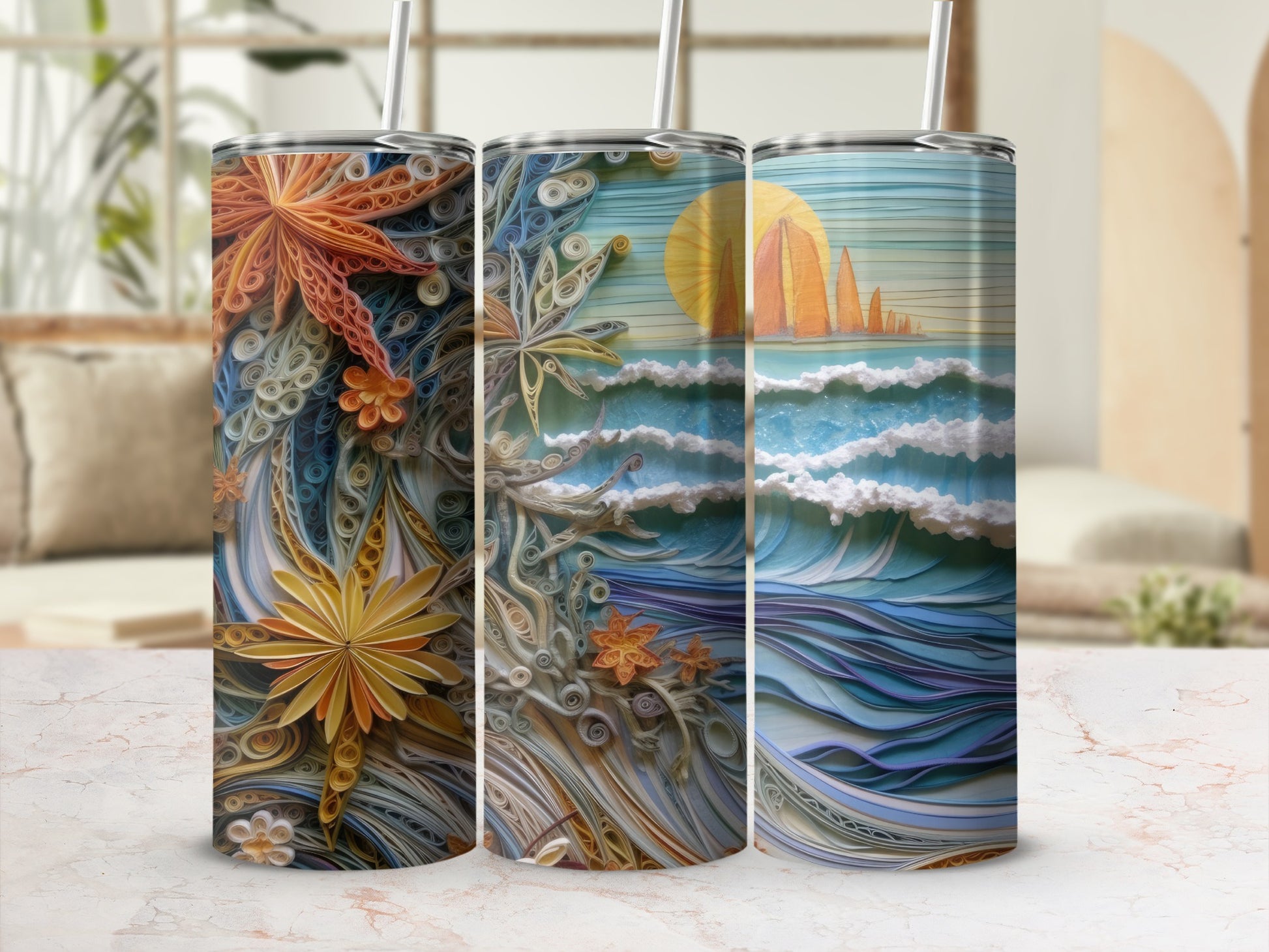 Three tumblers with detailed quilled paper art of a sunset seascape and floral elements.
