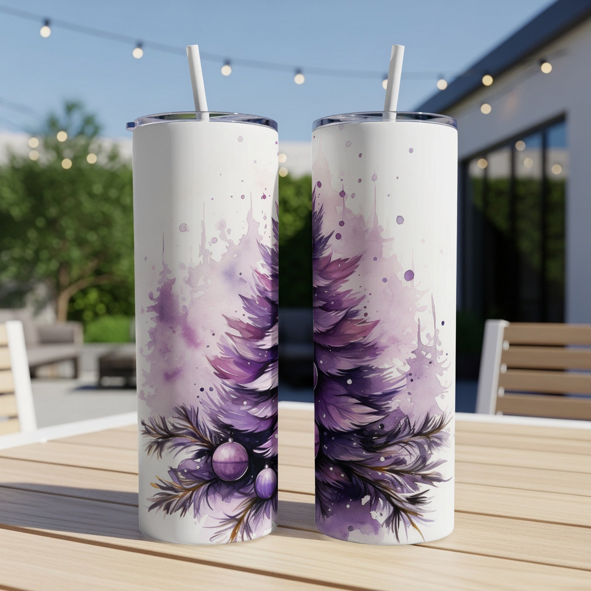 Two tall, slender tumblers with a purple watercolor Christmas tree design.