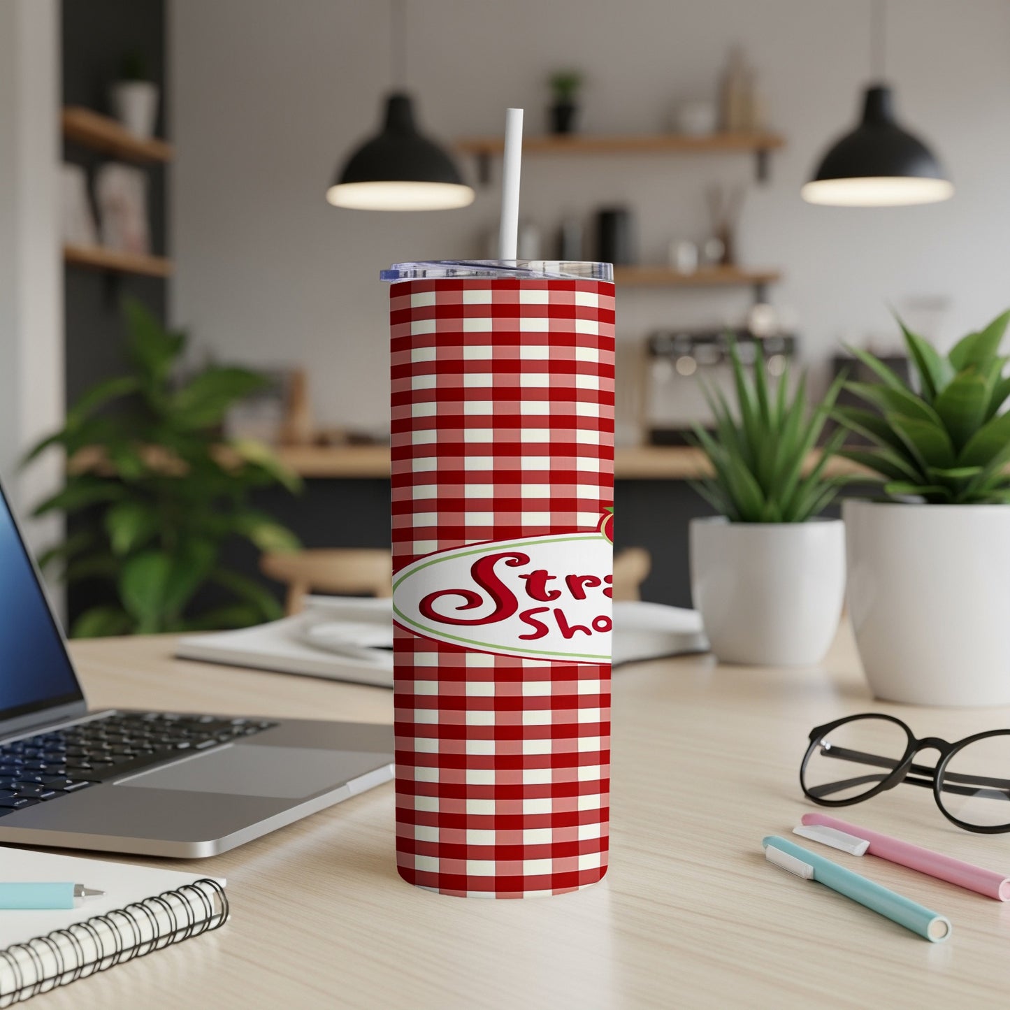 Red and white gingham tumbler with "Strawberry Shortcake" logo and straw.