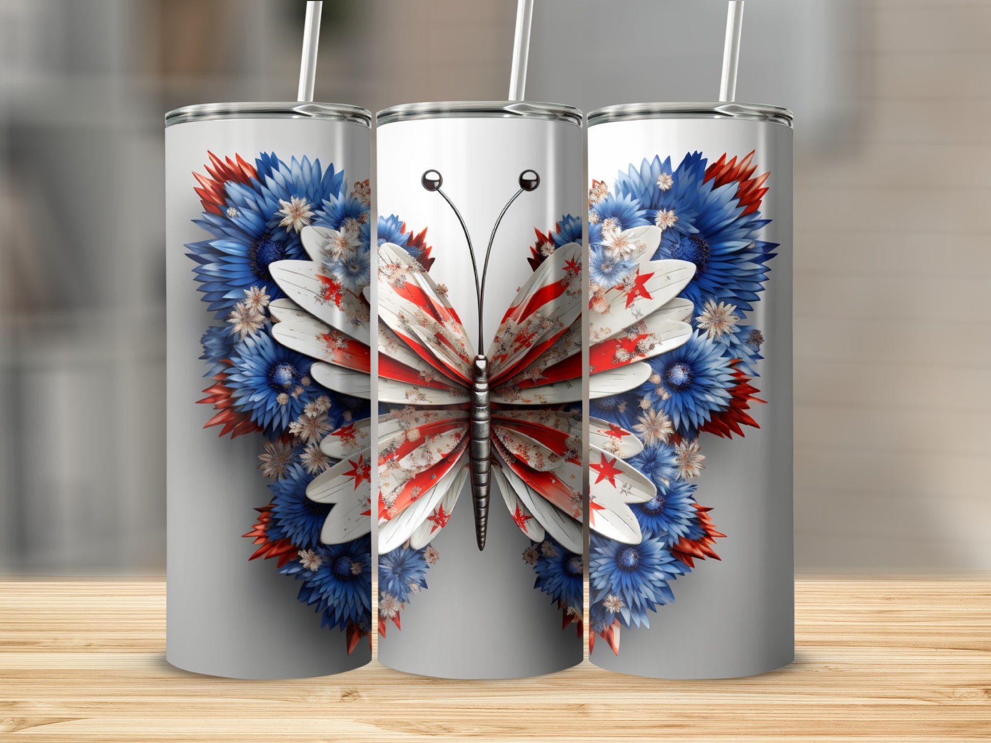 Three tumblers featuring a red, white, and blue butterfly design.