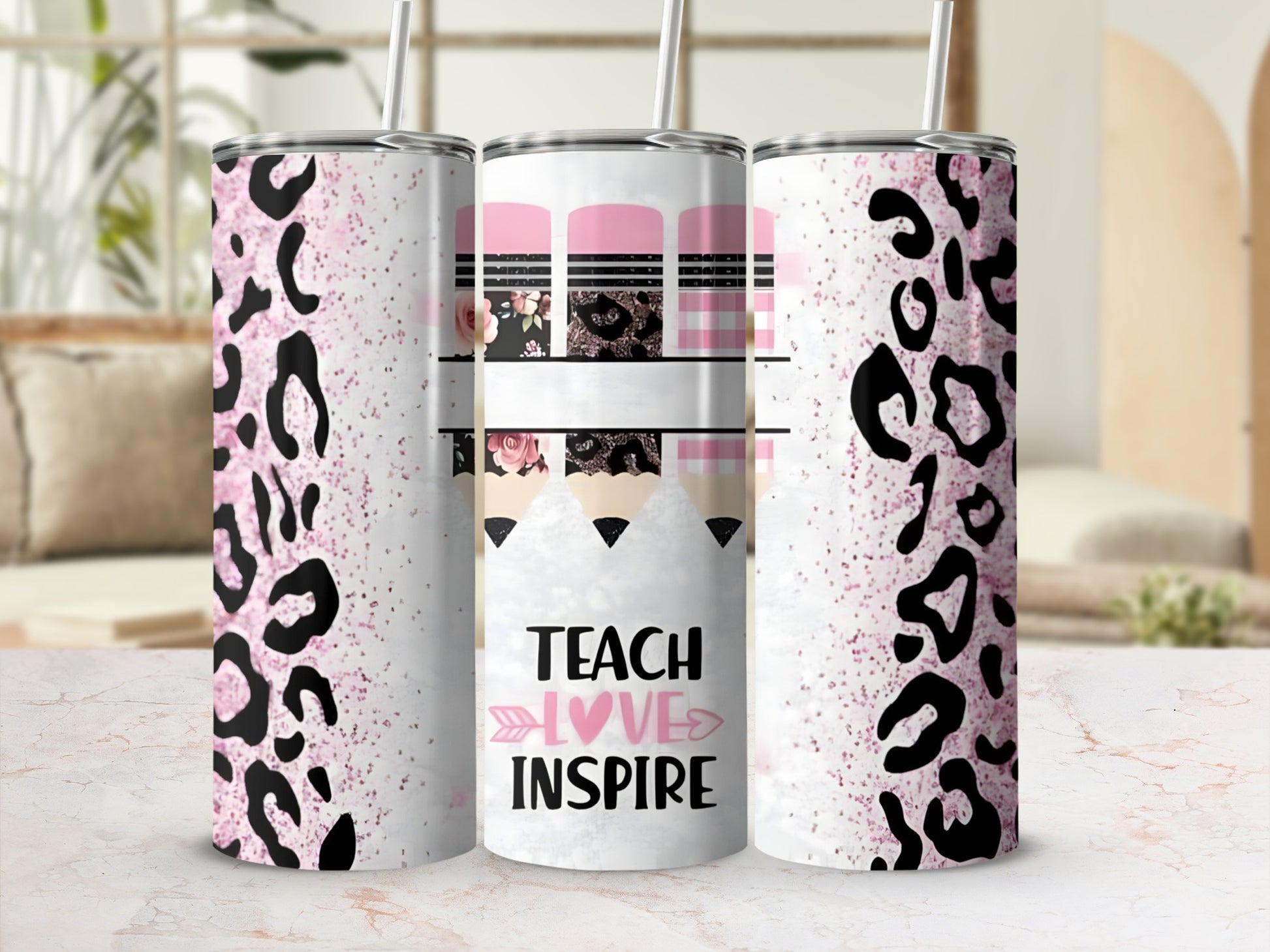 Pink tumbler with leopard print, pencils, and "Teach Love Inspire" text.
