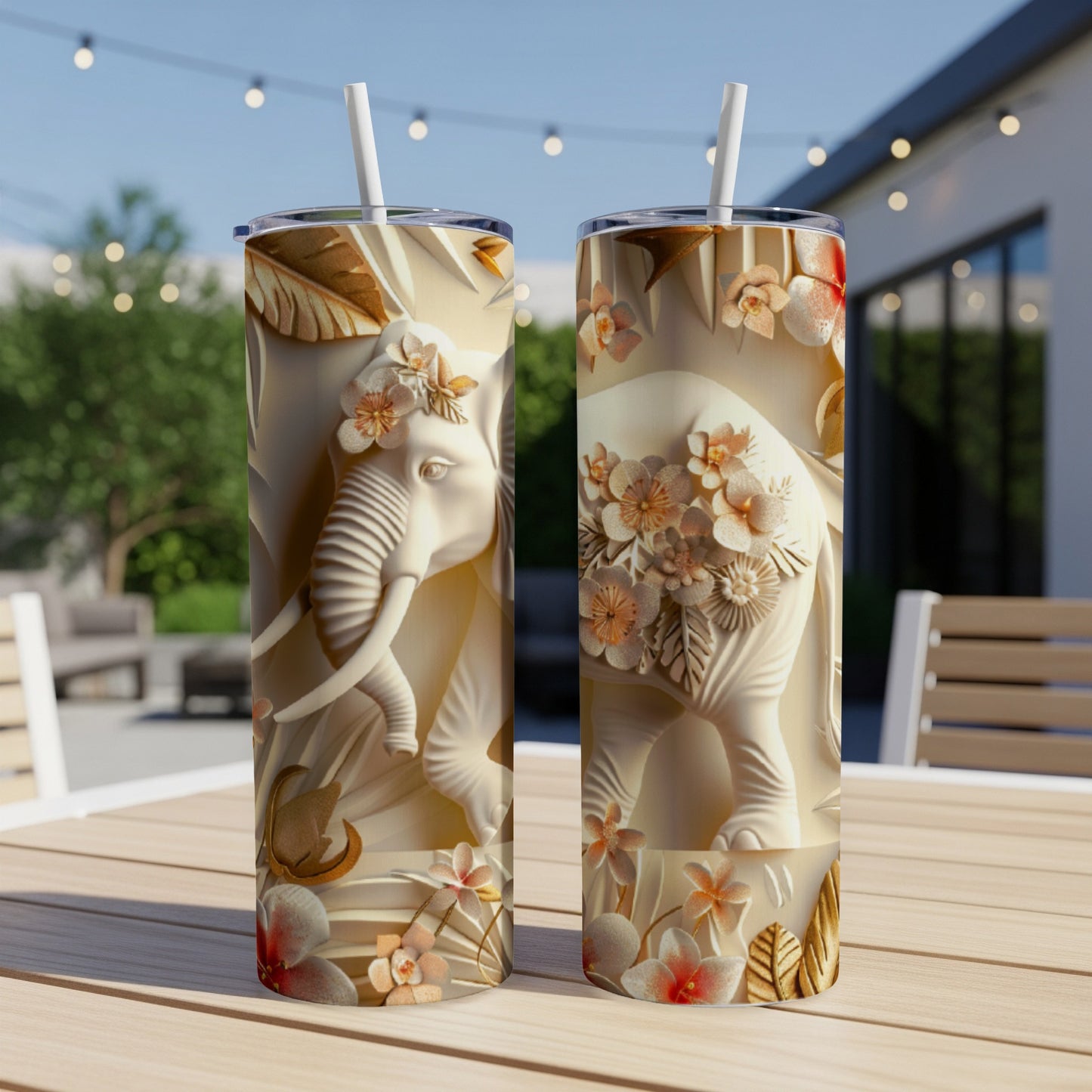 Two white tumblers with embossed elephant and floral designs.