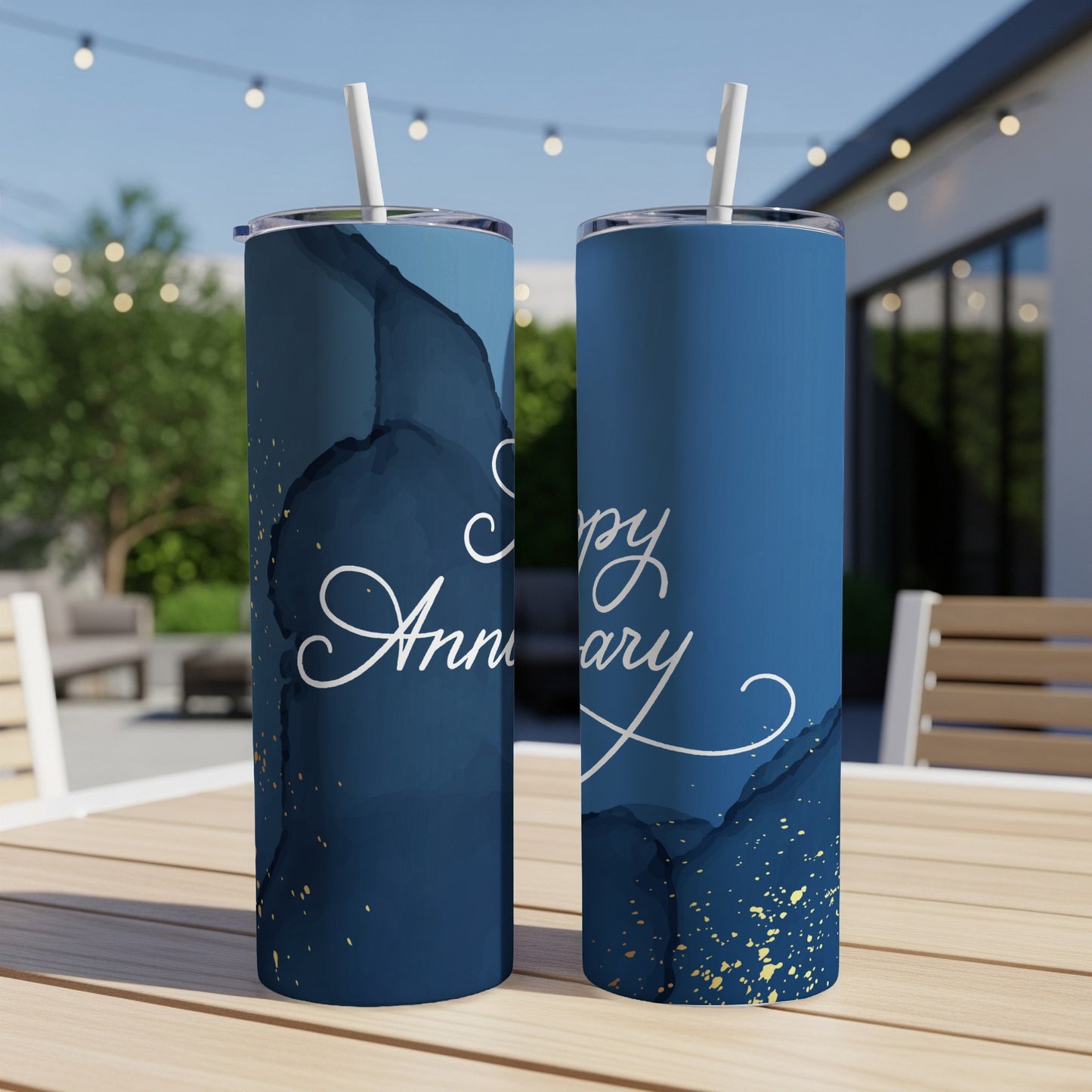 Blue tumbler with gold splatter and "Happy Anniversary" text.