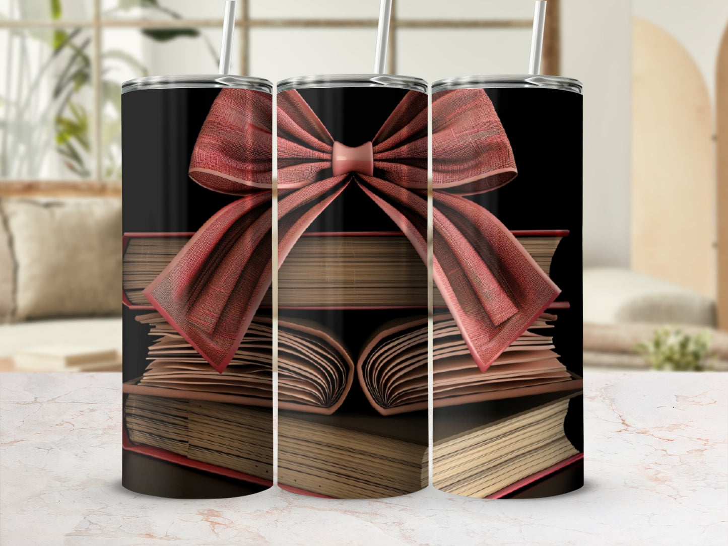 Three stacked books with a red bow, a tumbler design.