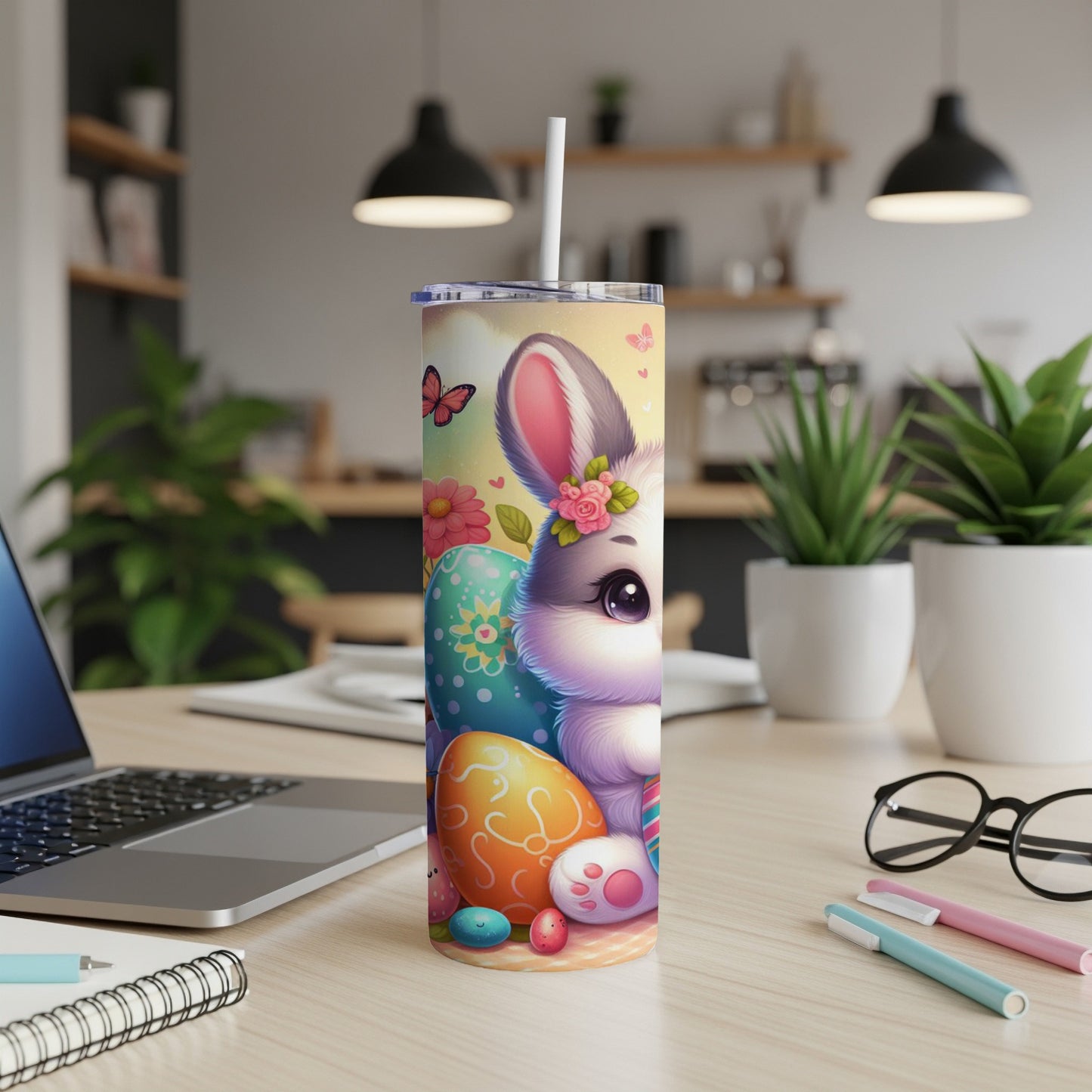 Cute Easter bunny with colorful eggs and flowers, on a tumbler.