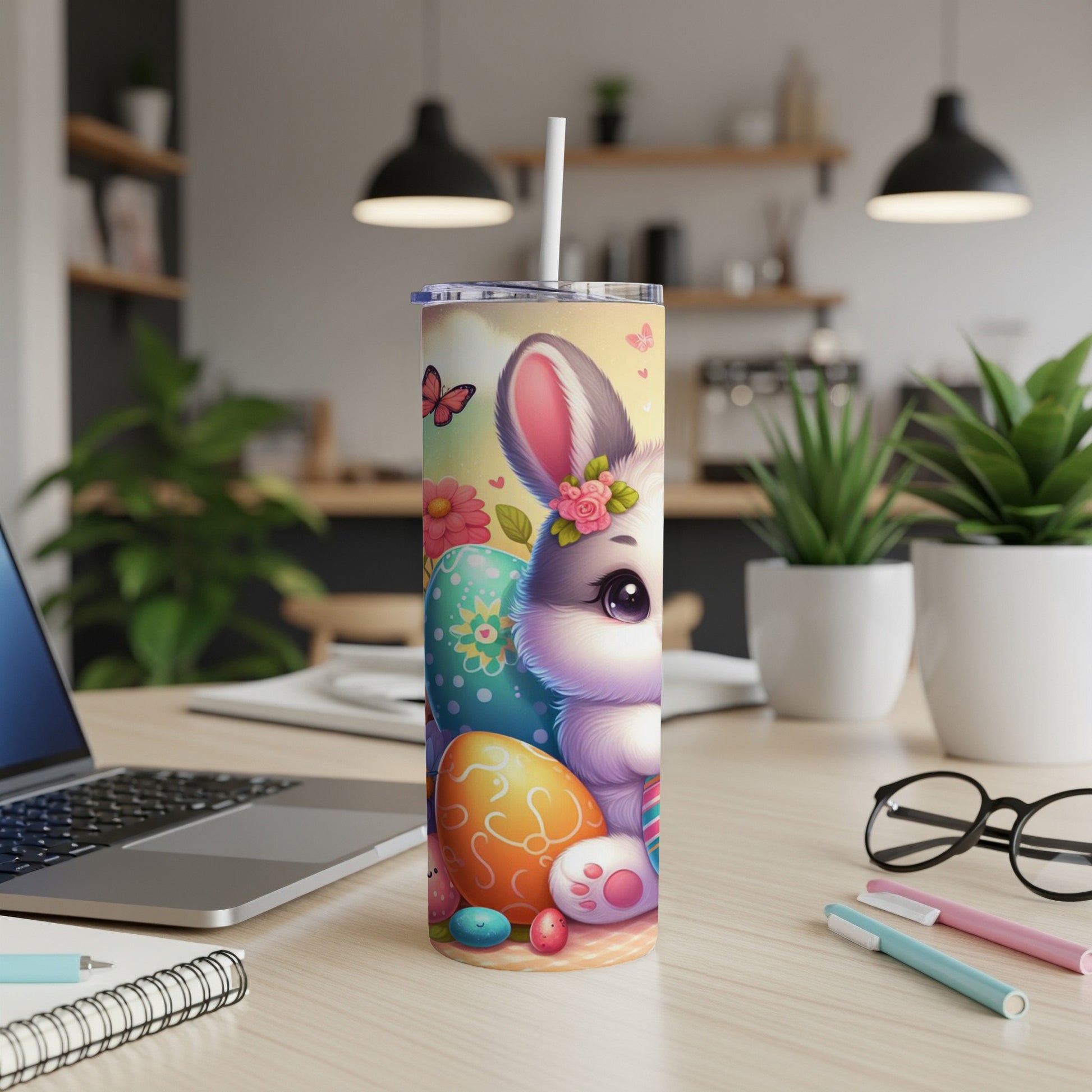Cute Easter bunny with colorful eggs and flowers, on a tumbler.