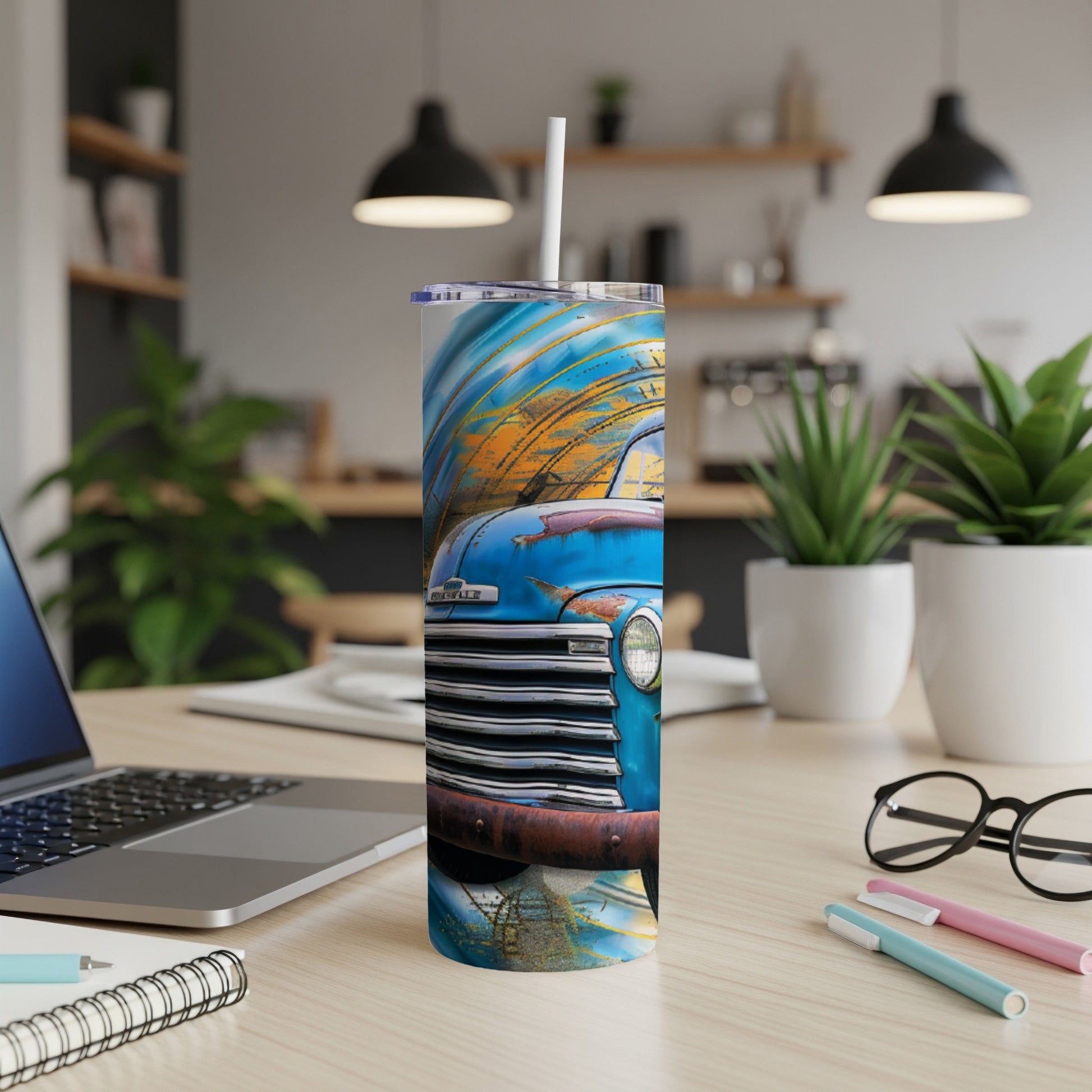 Blue vintage pickup truck with abstract orange and blue background on a tumbler.
