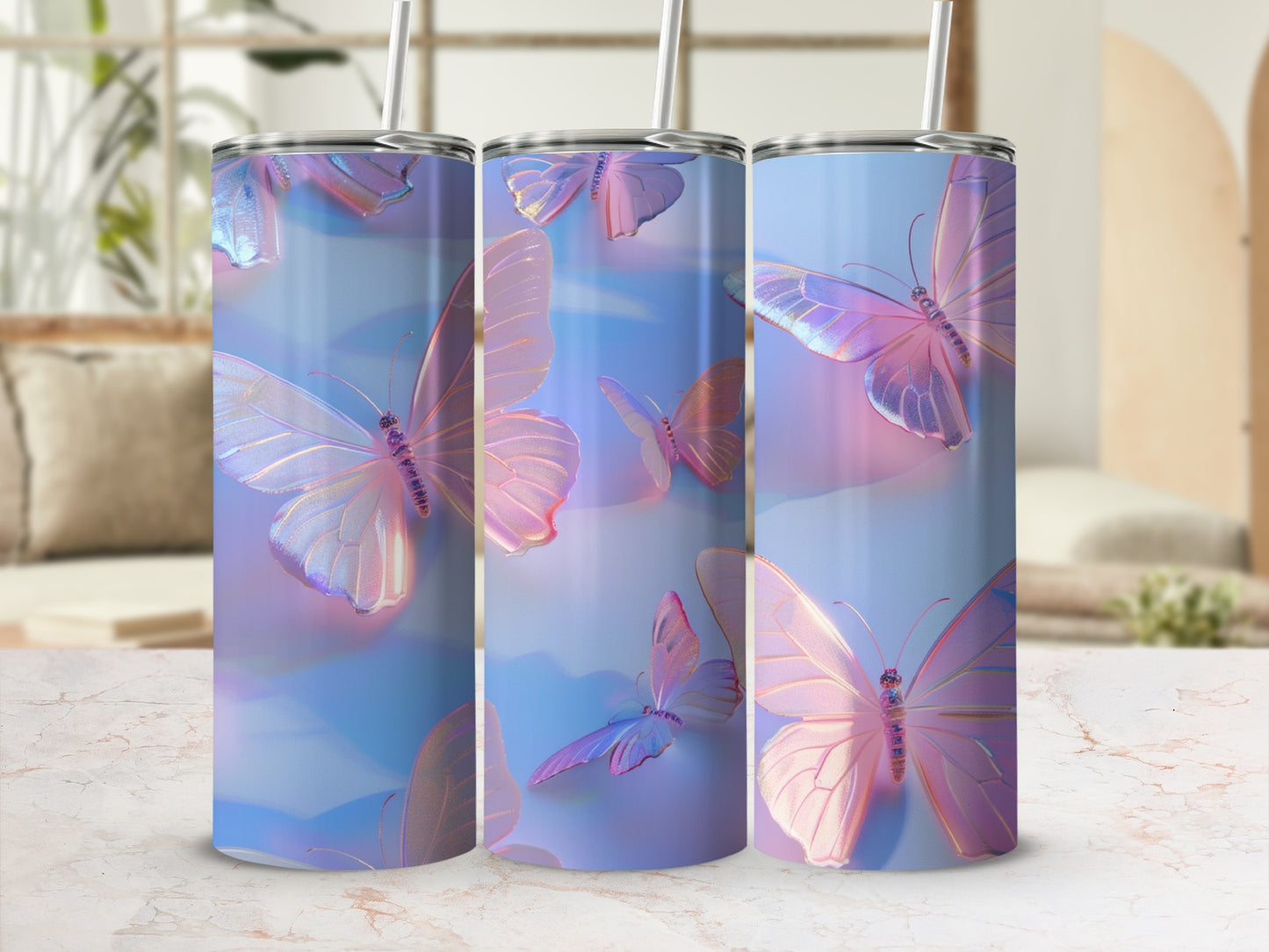 Three iridescent tumblers with butterfly designs sit on a patterned surface.