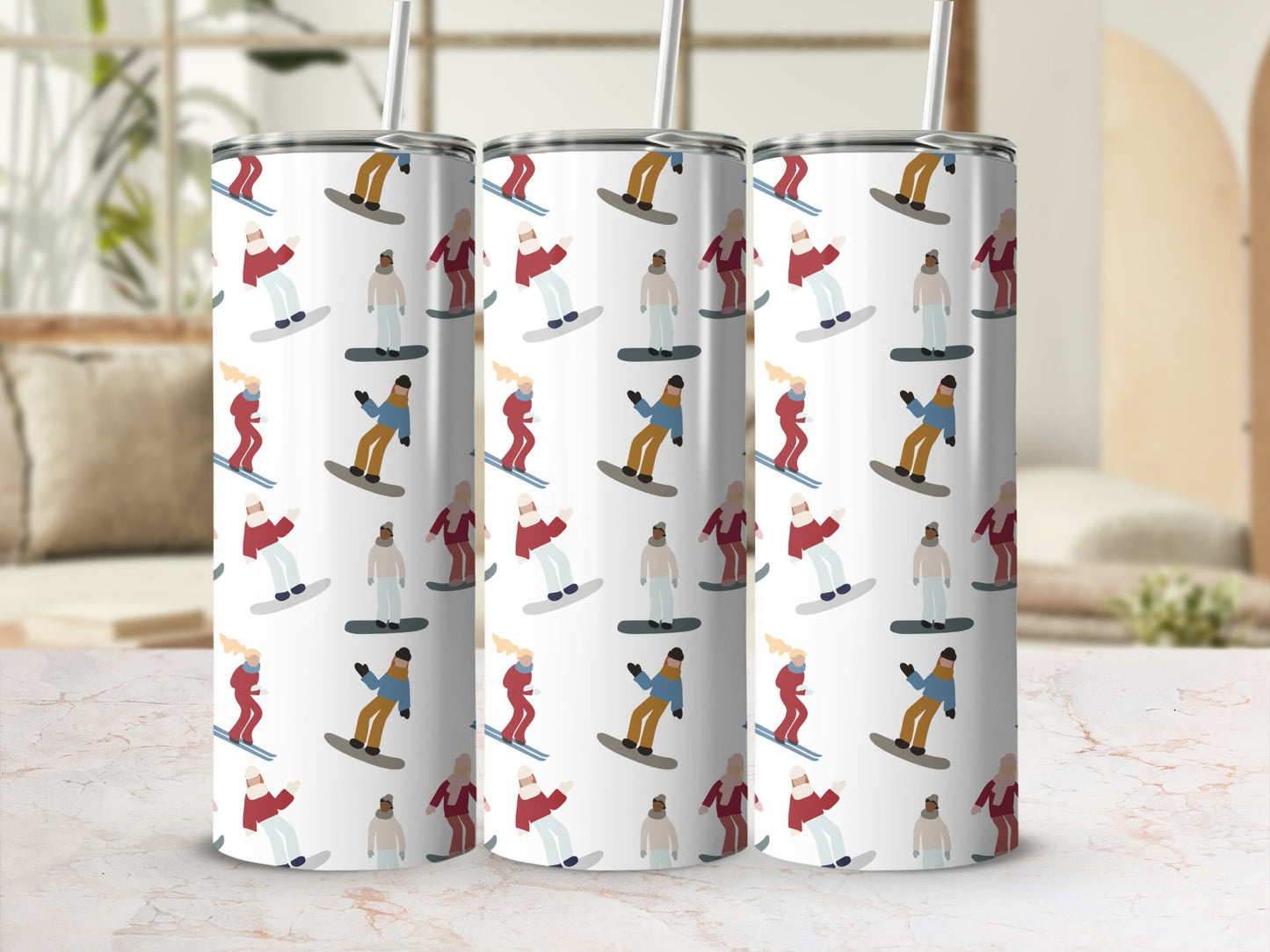 Three tumblers with a repeating pattern of skiers and snowboarders.