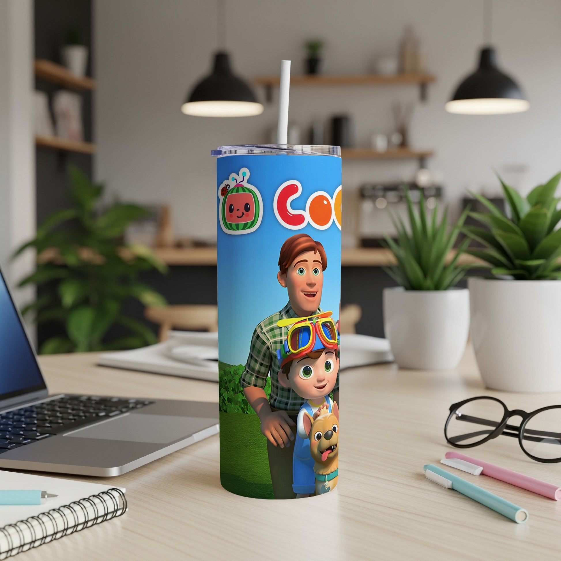 Cocomelon JJ and YoYo characters on a colorful tumbler with a straw.