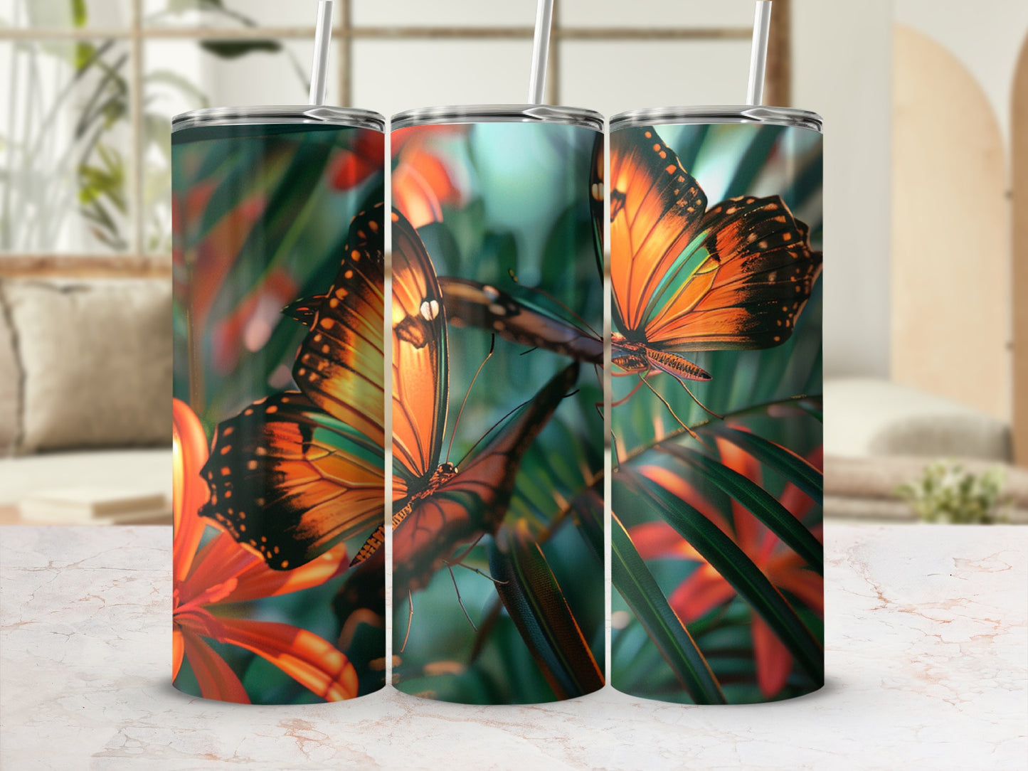 Three tumblers with vibrant butterfly and floral pattern.