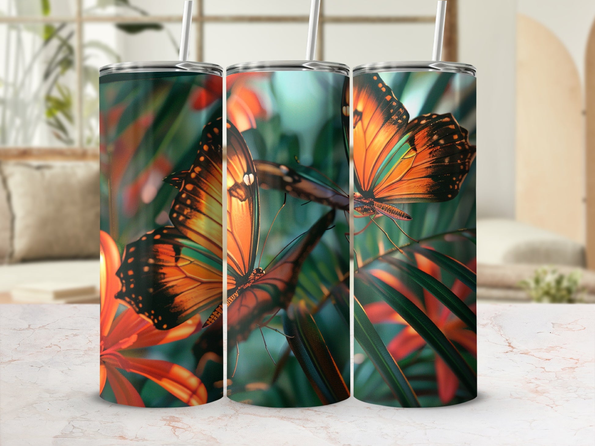 Three tumblers with vibrant butterfly and floral pattern.
