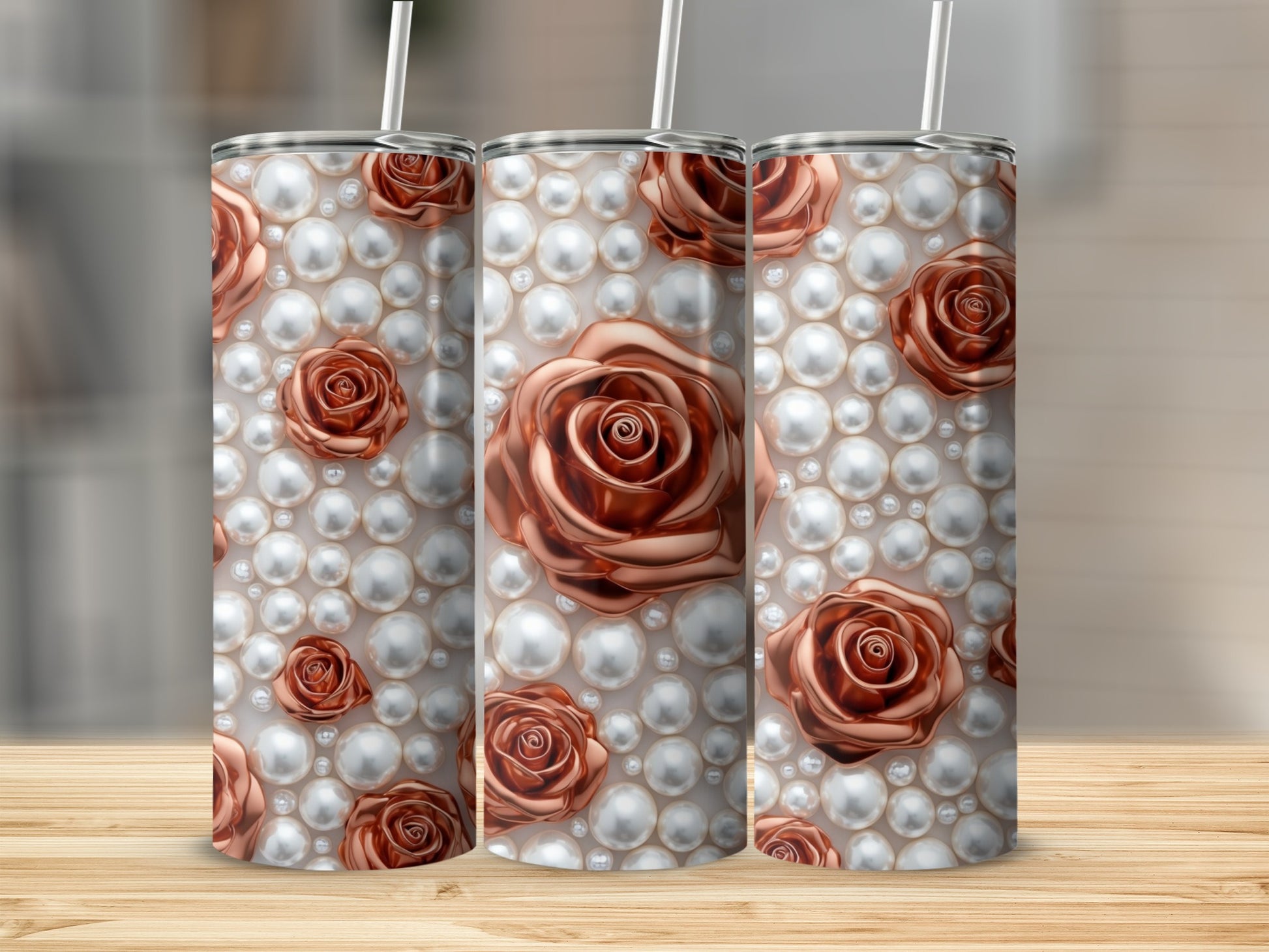 Rose and pearl pattern on three tall tumblers with straws.