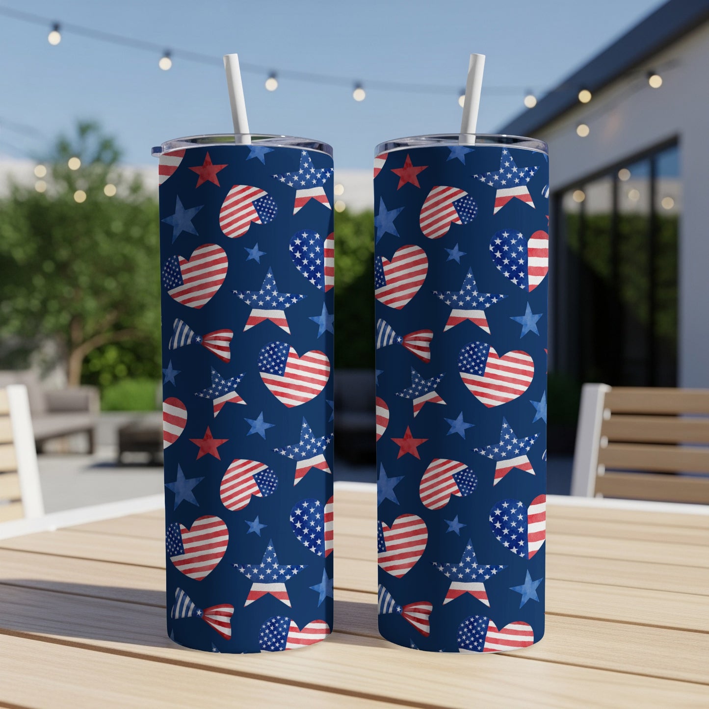 Two navy blue tumblers with red and white stars and hearts pattern.