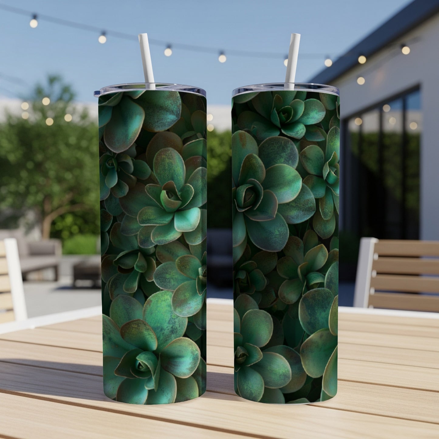 Two tumblers with green succulent plant pattern on a wooden table.