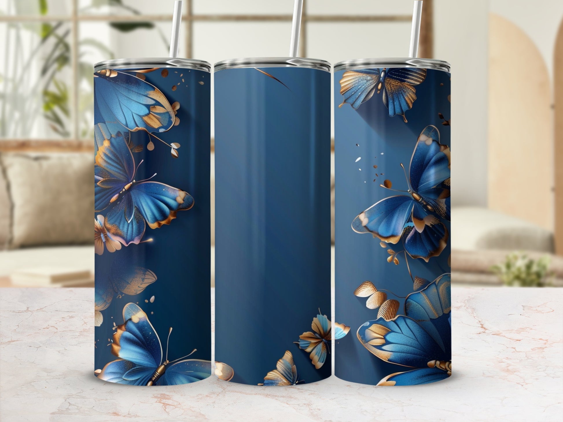 Three navy blue tumblers with golden butterflies and foliage designs.