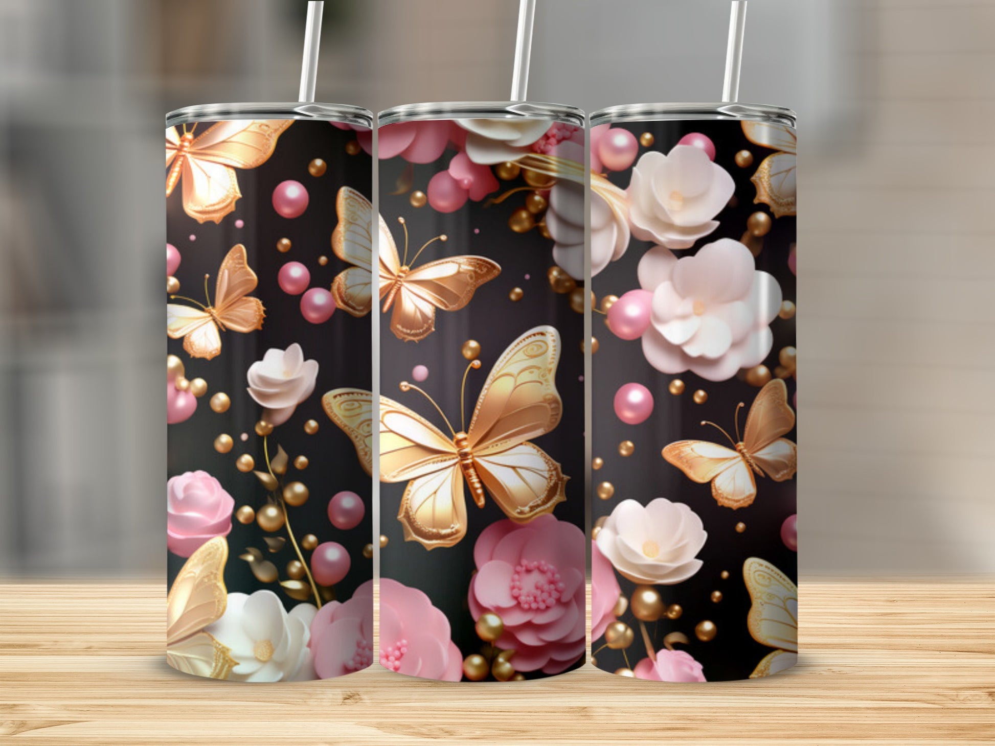 Triptych of tumblers with gold butterflies and pink flowers on black.