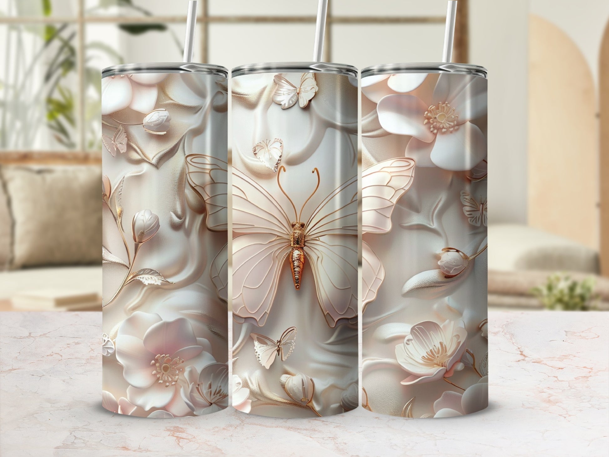 Triptych of tumblers featuring embossed butterflies and floral designs.