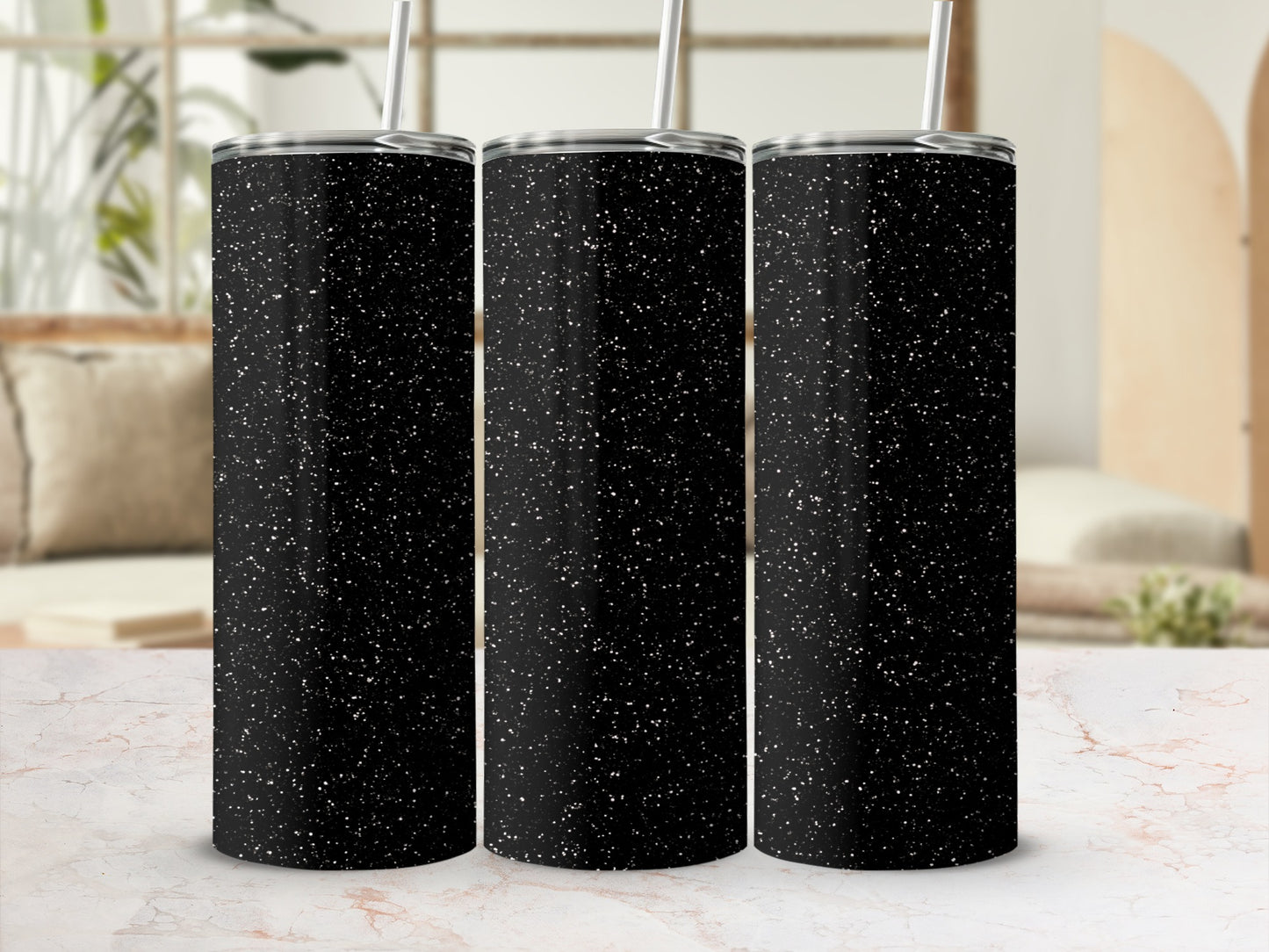 Three black tumblers with white speckles, side-by-side.