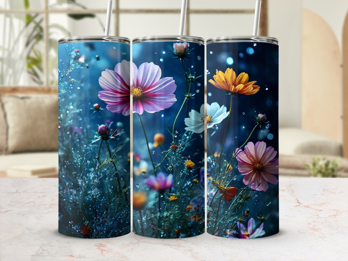 Three floral tumblers with cosmos flowers against a bokeh background.