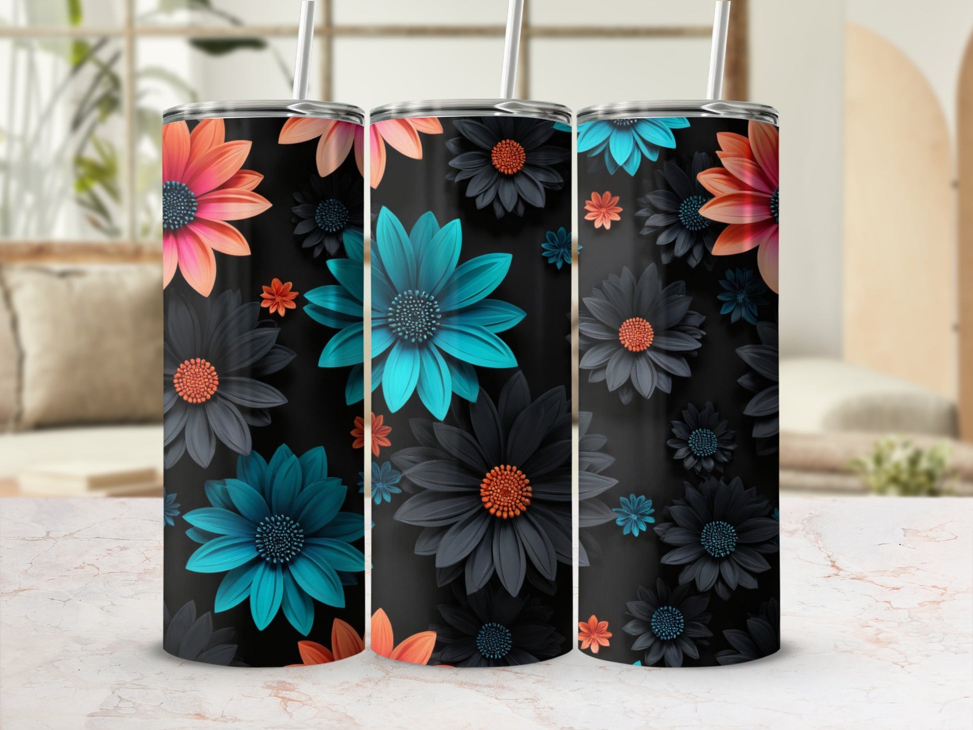 Three tumblers with floral designs featuring teal, coral, and dark blue flowers.