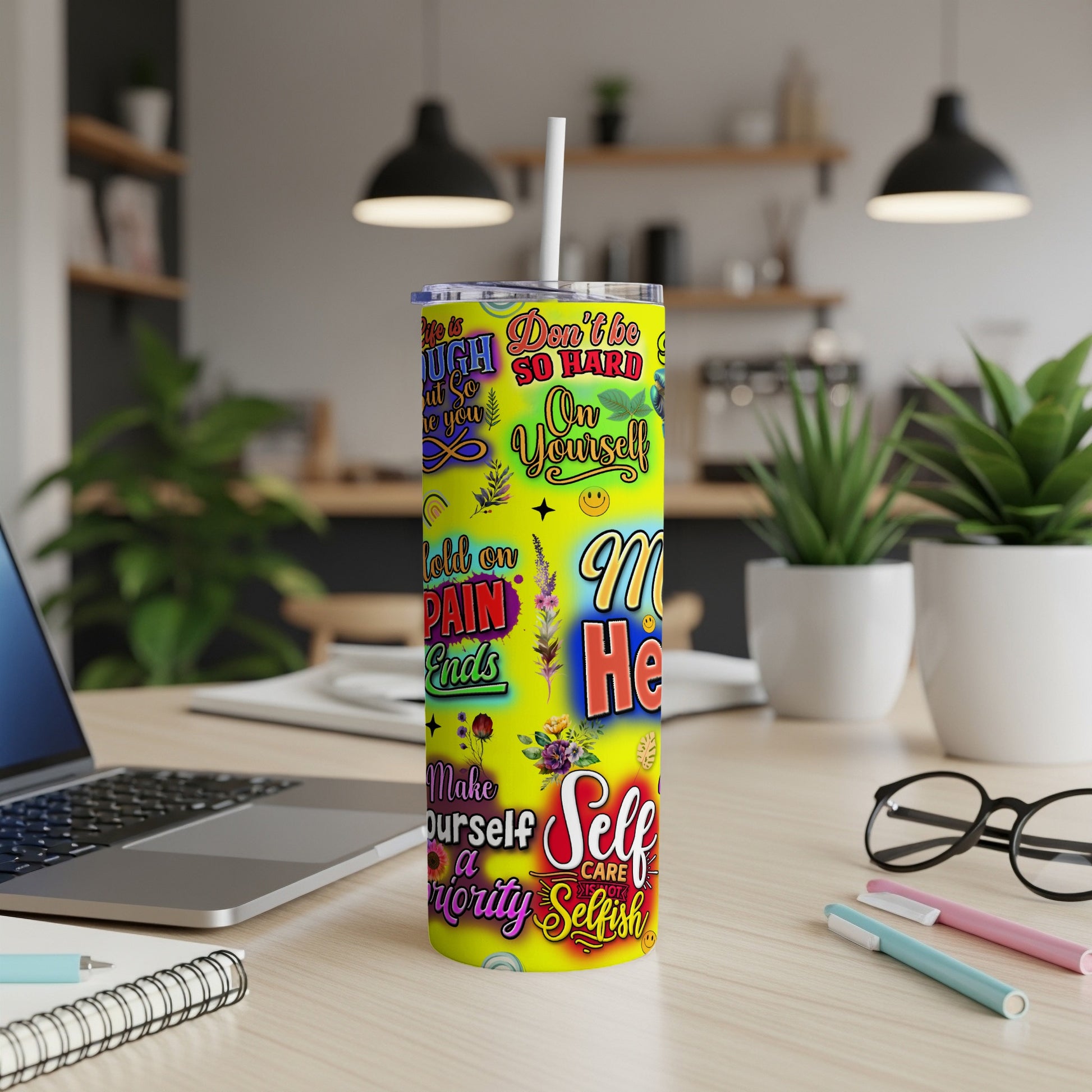Tumbler with bright yellow background and motivational quotes.