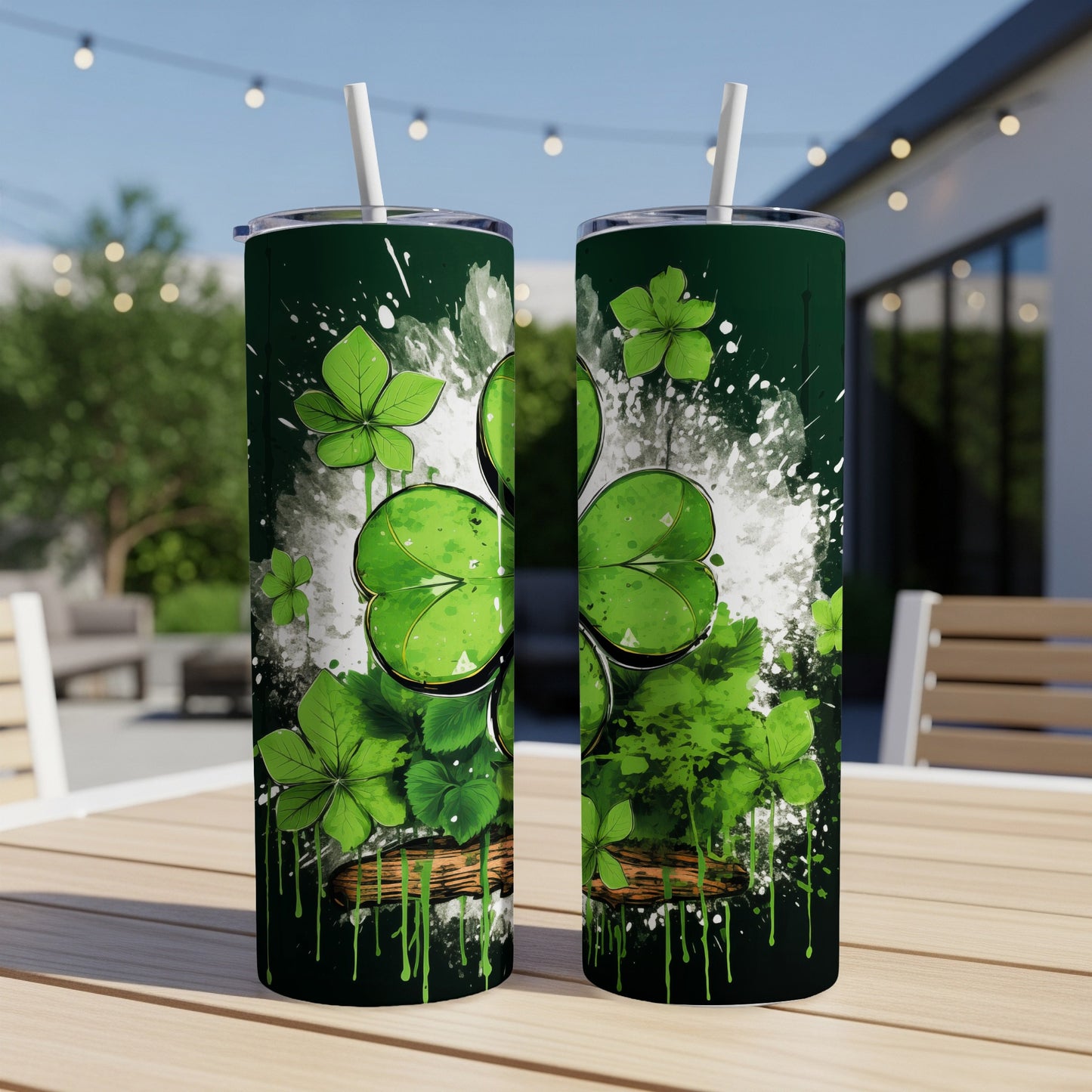 Two green tumblers with shamrock and paint splash design.