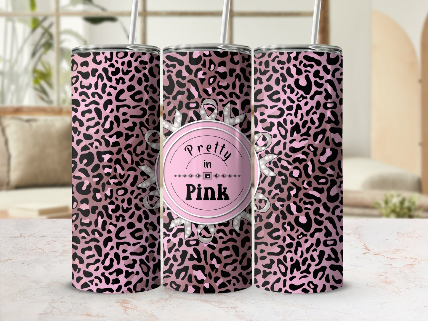 Pink leopard print tumbler with "Pretty in Pink" text on a circular emblem.